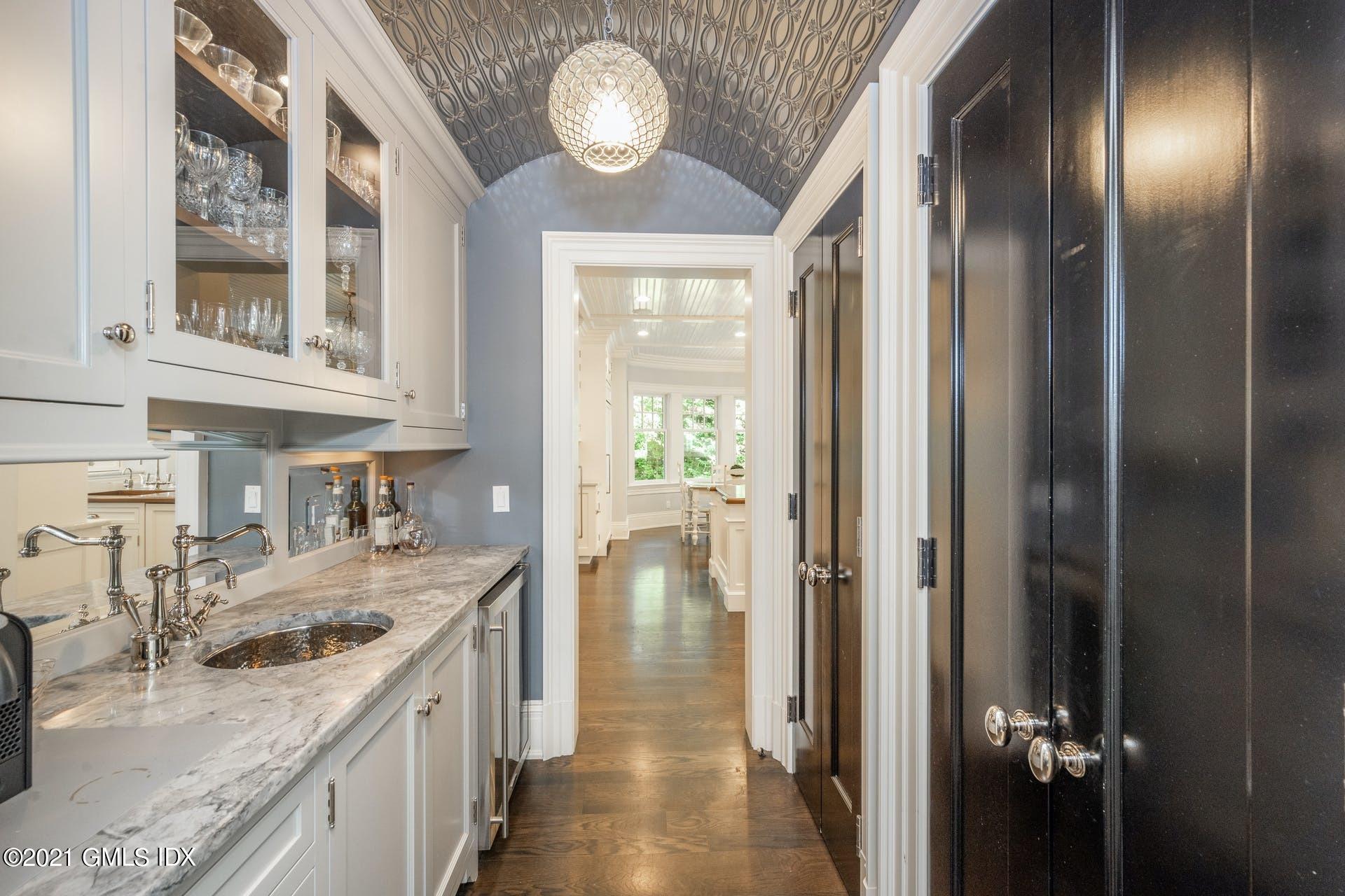 45 Willow Road Riverside, CT 06878 - Photo 15 of 38 a kitchen with a refrigerator and a sink