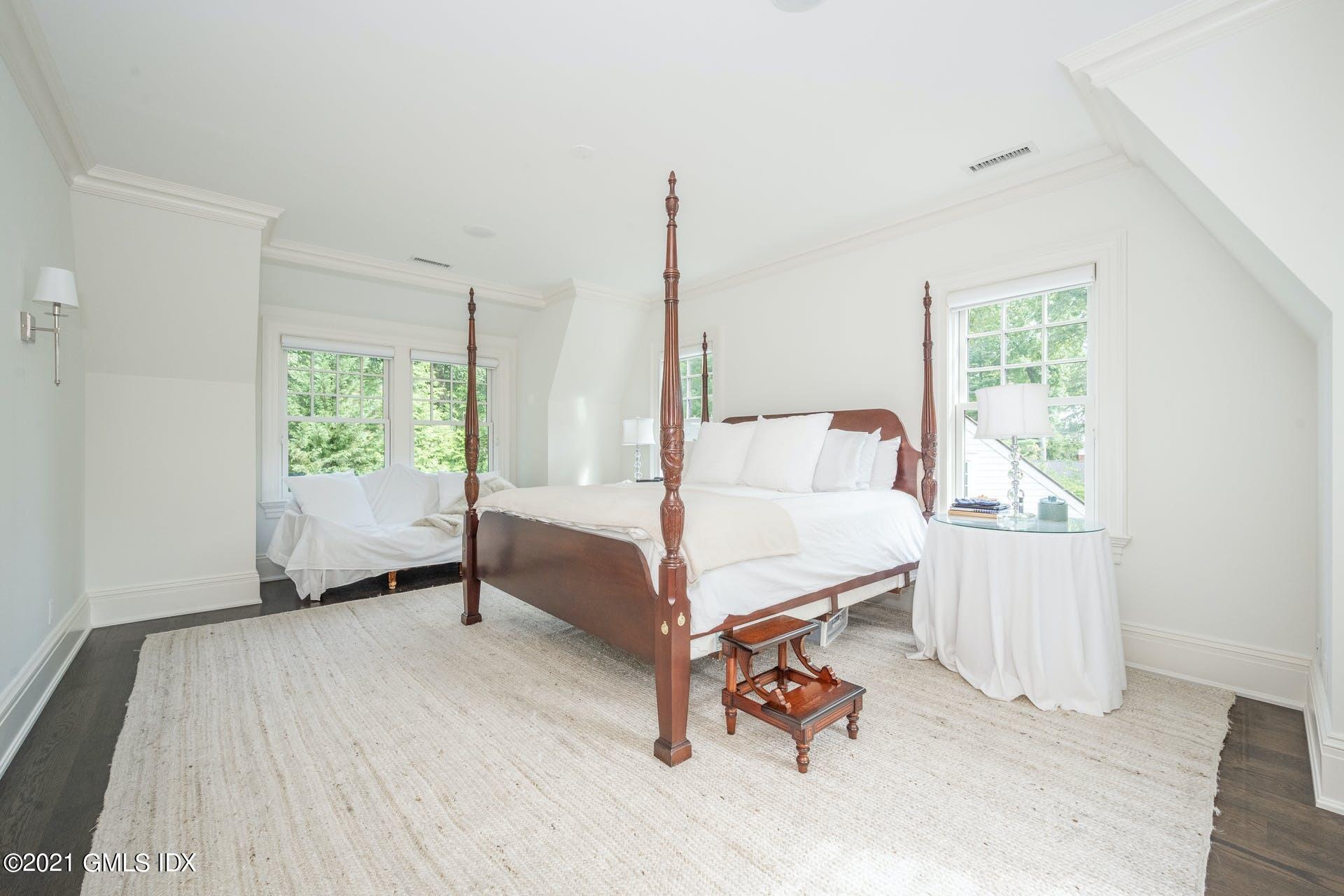 45 Willow Road Riverside, CT 06878 - Photo 19 of 38 a bedroom with a bed and a window