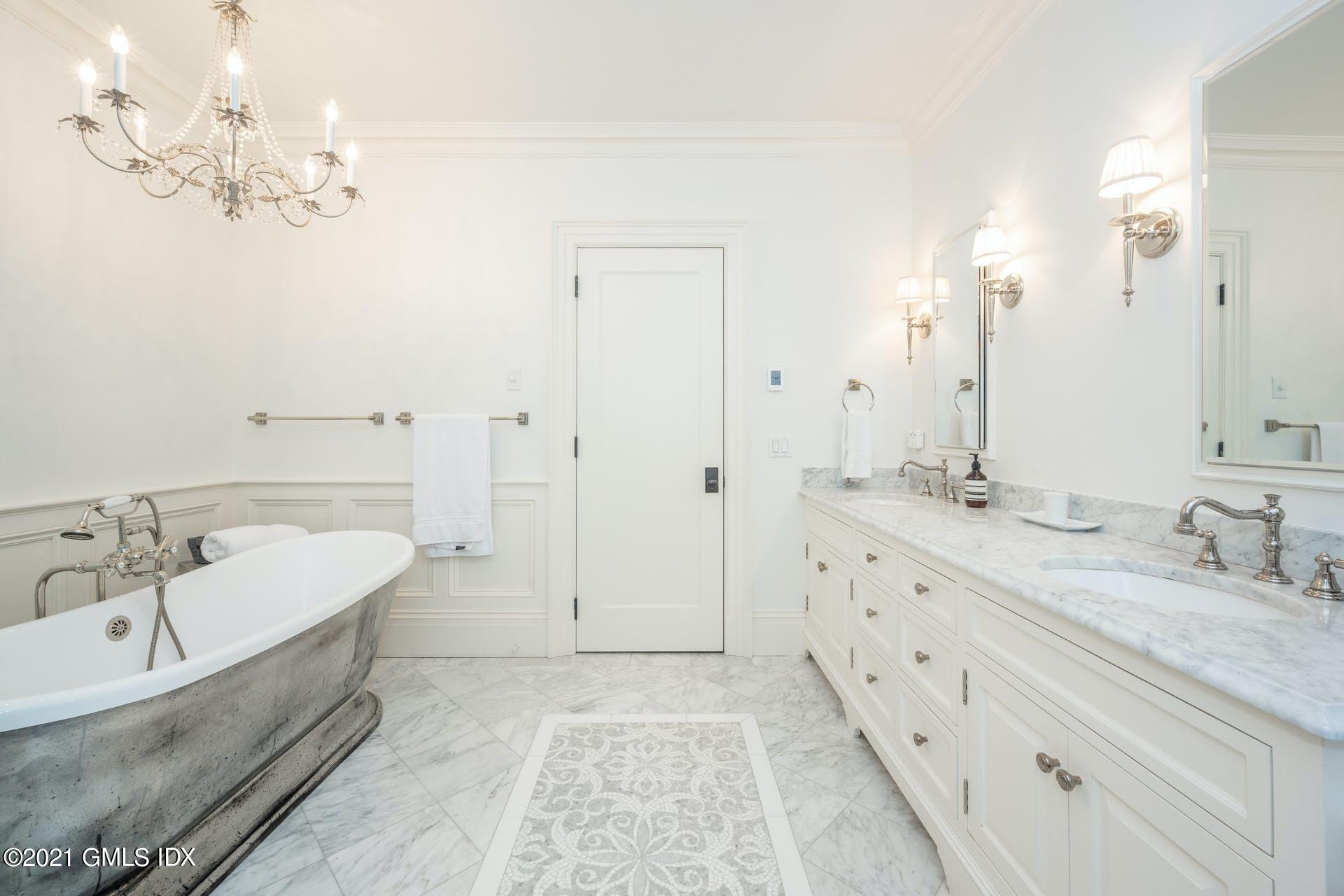 45 Willow Road Riverside, CT 06878 - Photo 21 of 38 a spacious bathroom with double vanity sink a mirror and a bathtub