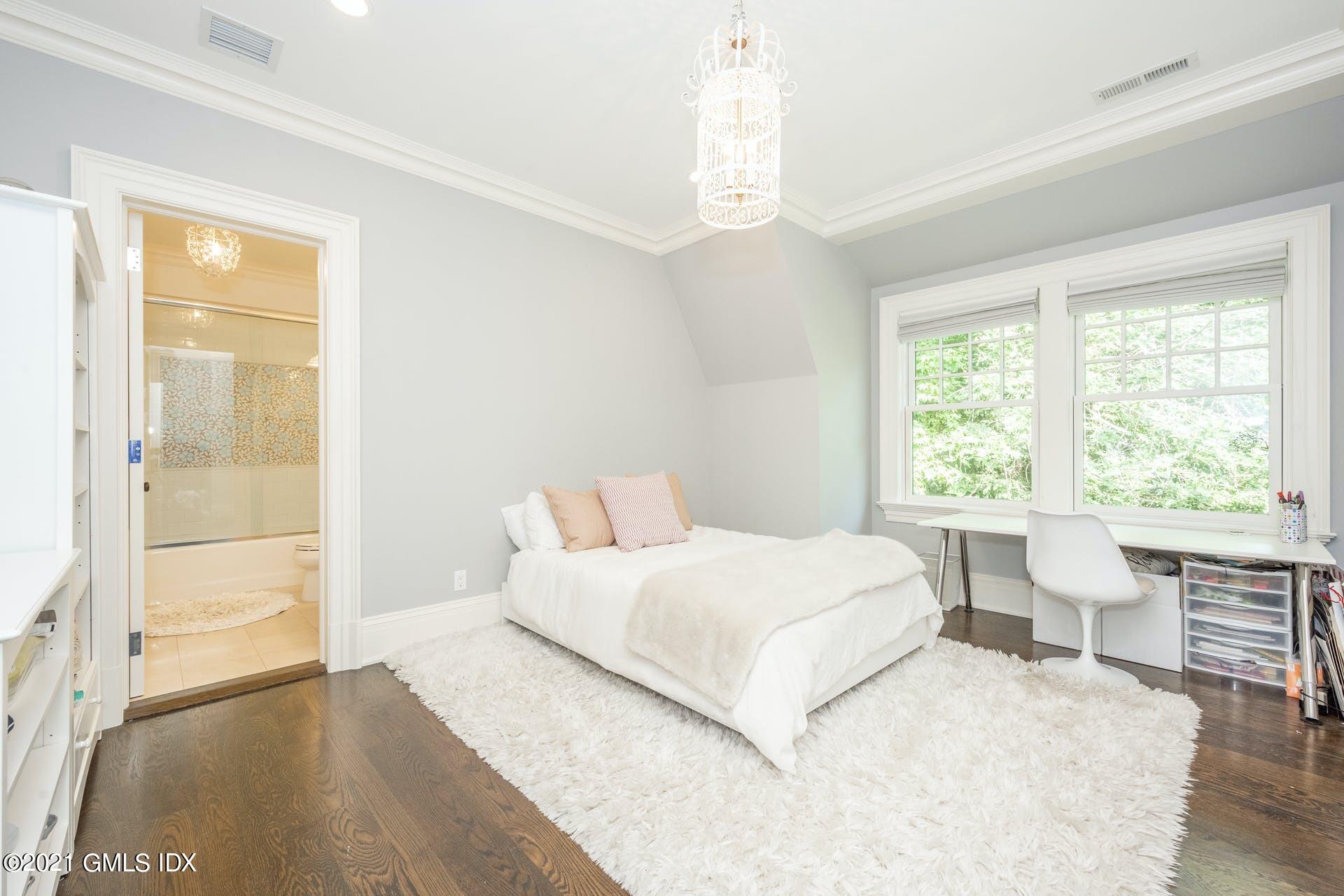 45 Willow Road Riverside, CT 06878 - Photo 23 of 38 a bedroom with a large bed and a window