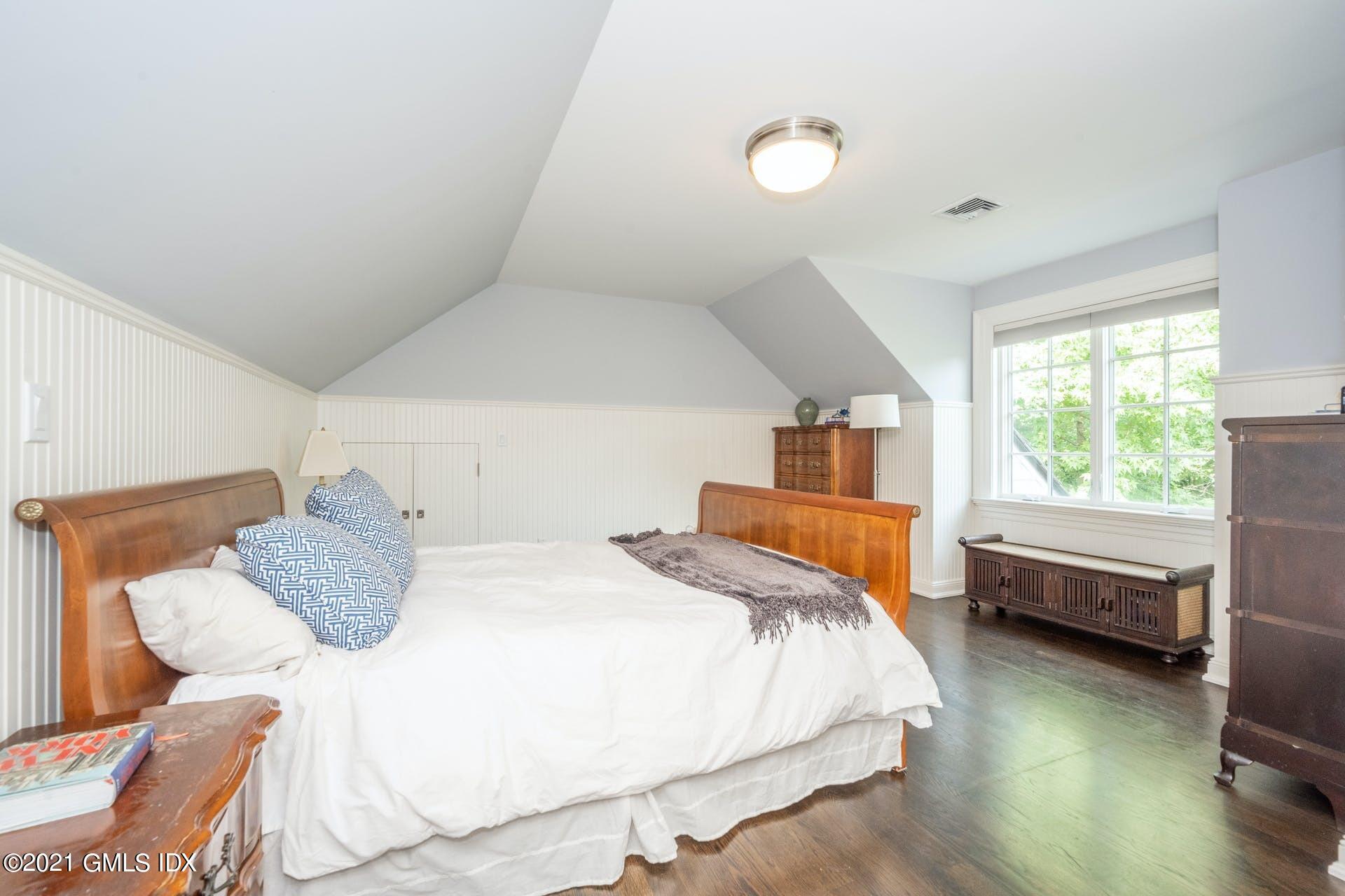 45 Willow Road Riverside, CT 06878 - Photo 30 of 38 a bedroom with a bed and window