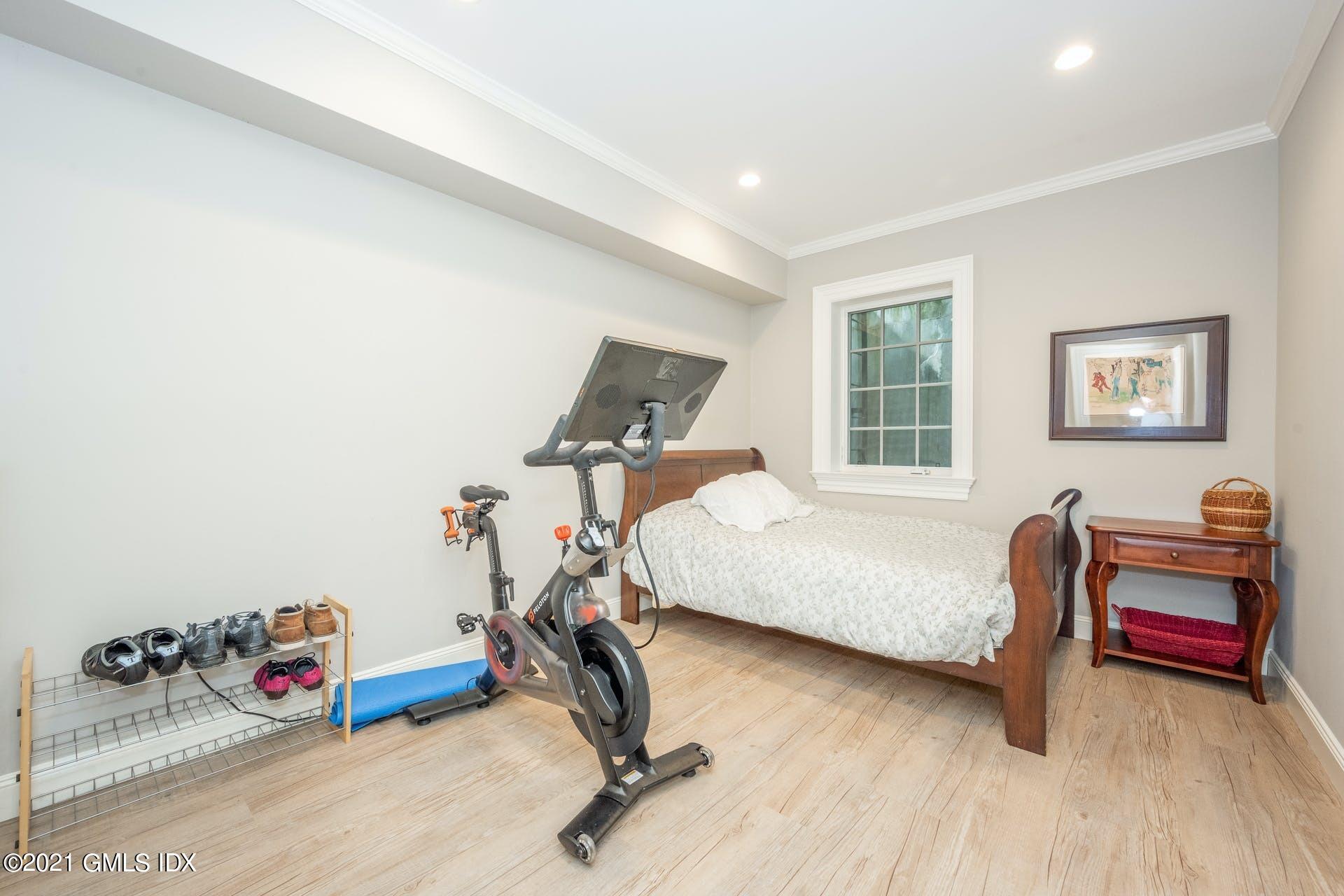 45 Willow Road Riverside, CT 06878 - Photo 34 of 38 a bedroom with furniture and a wooden floor