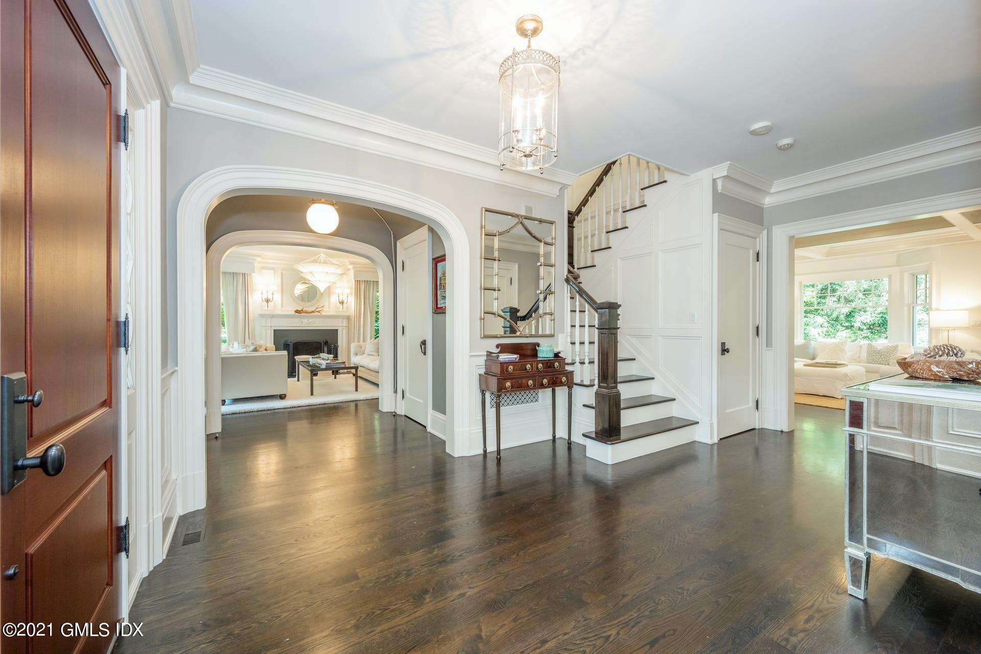 45 Willow Road Riverside, CT 06878 - Photo 5 of 38 a living room with fireplace furniture and a wooden floor