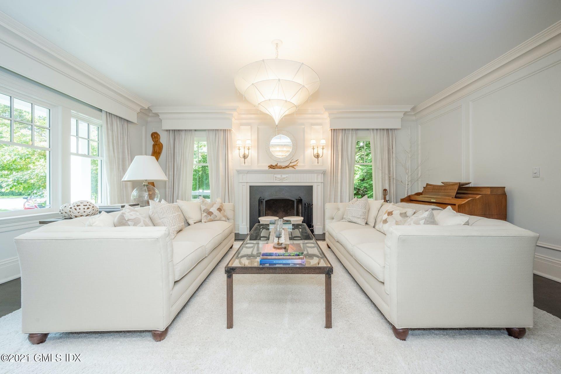 45 Willow Road Riverside, CT 06878 - Photo 6 of 38 a living room with furniture and a fireplace