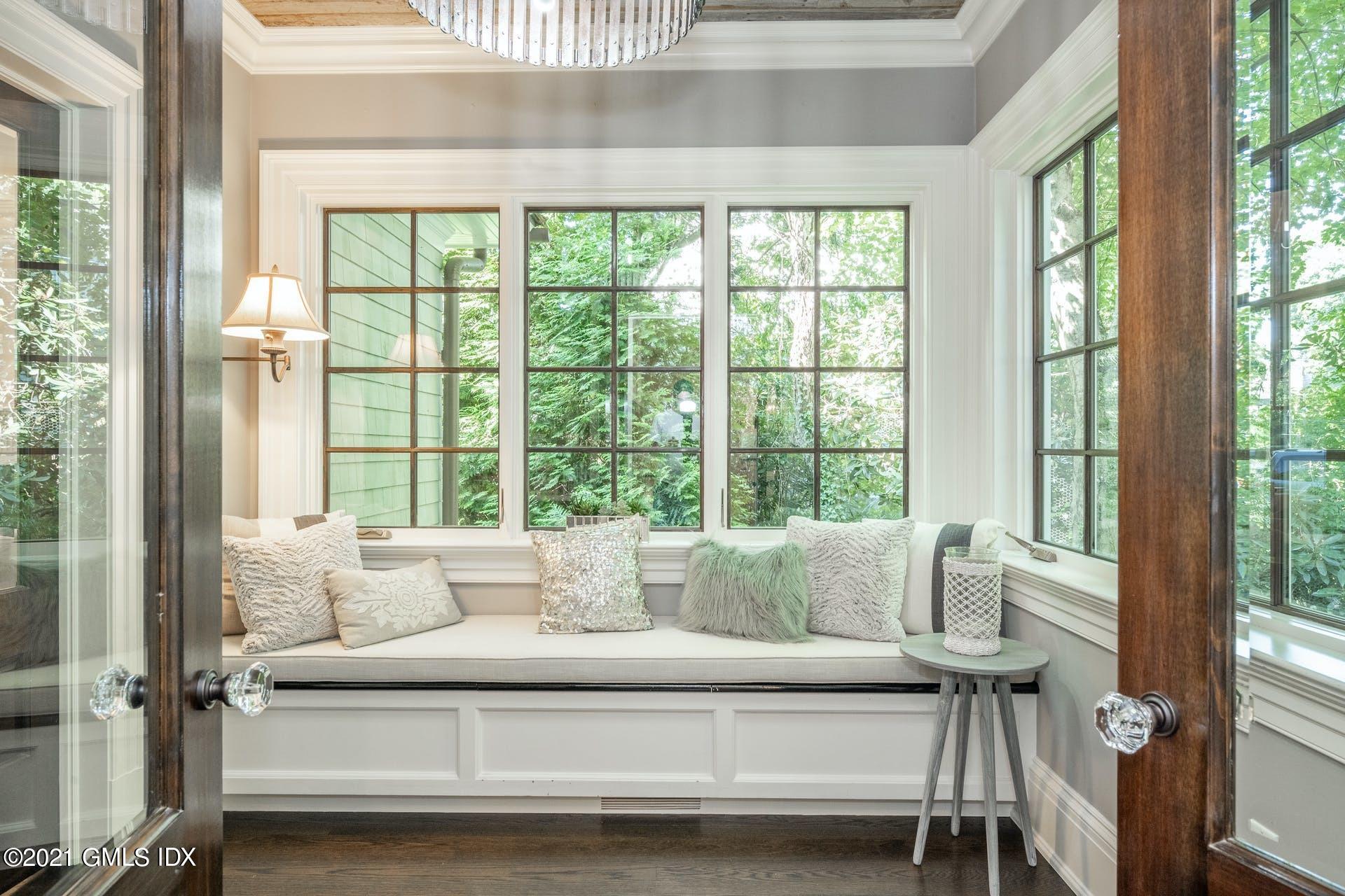 45 Willow Road Riverside, CT 06878 - Photo 10 of 38 a living room with furniture and large windows