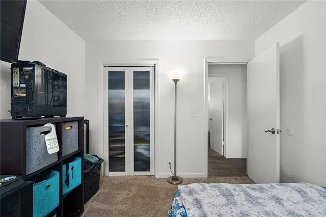 a bedroom with a bed and a television in it