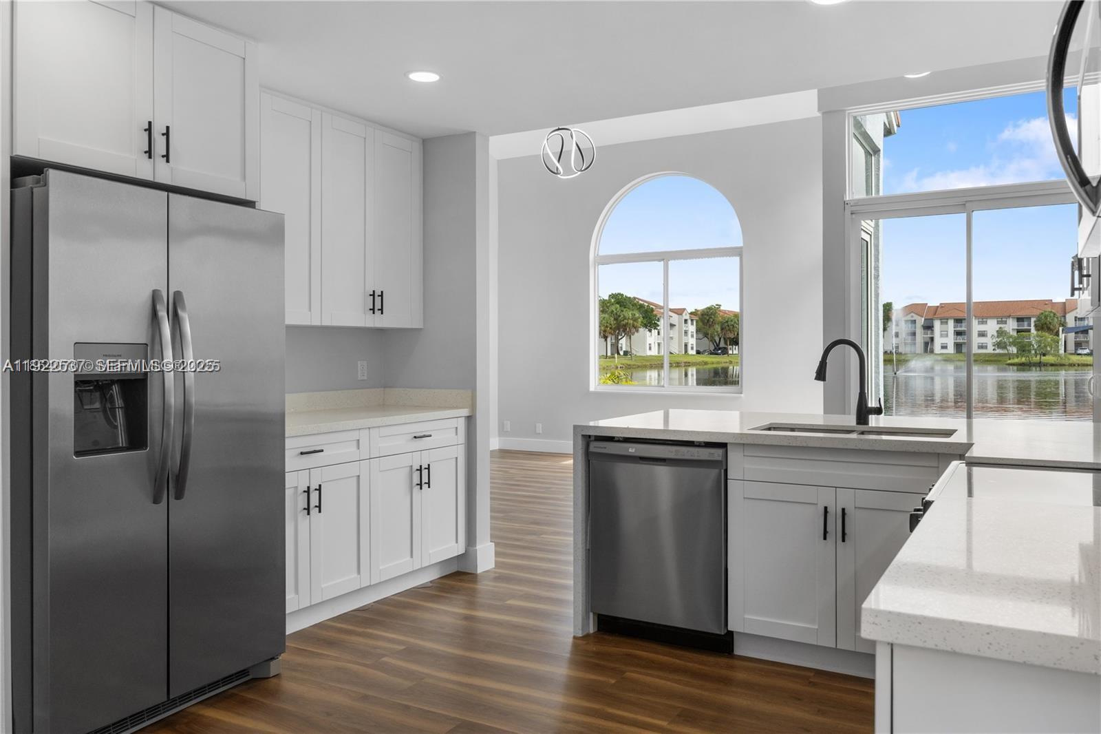 3835 Lombardy Street Hollywood, FL 33021 - Photo 11 of 25 a kitchen with a sink stainless steel appliances and window