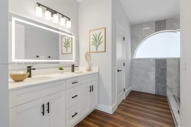 a bathroom with a sink and a mirror