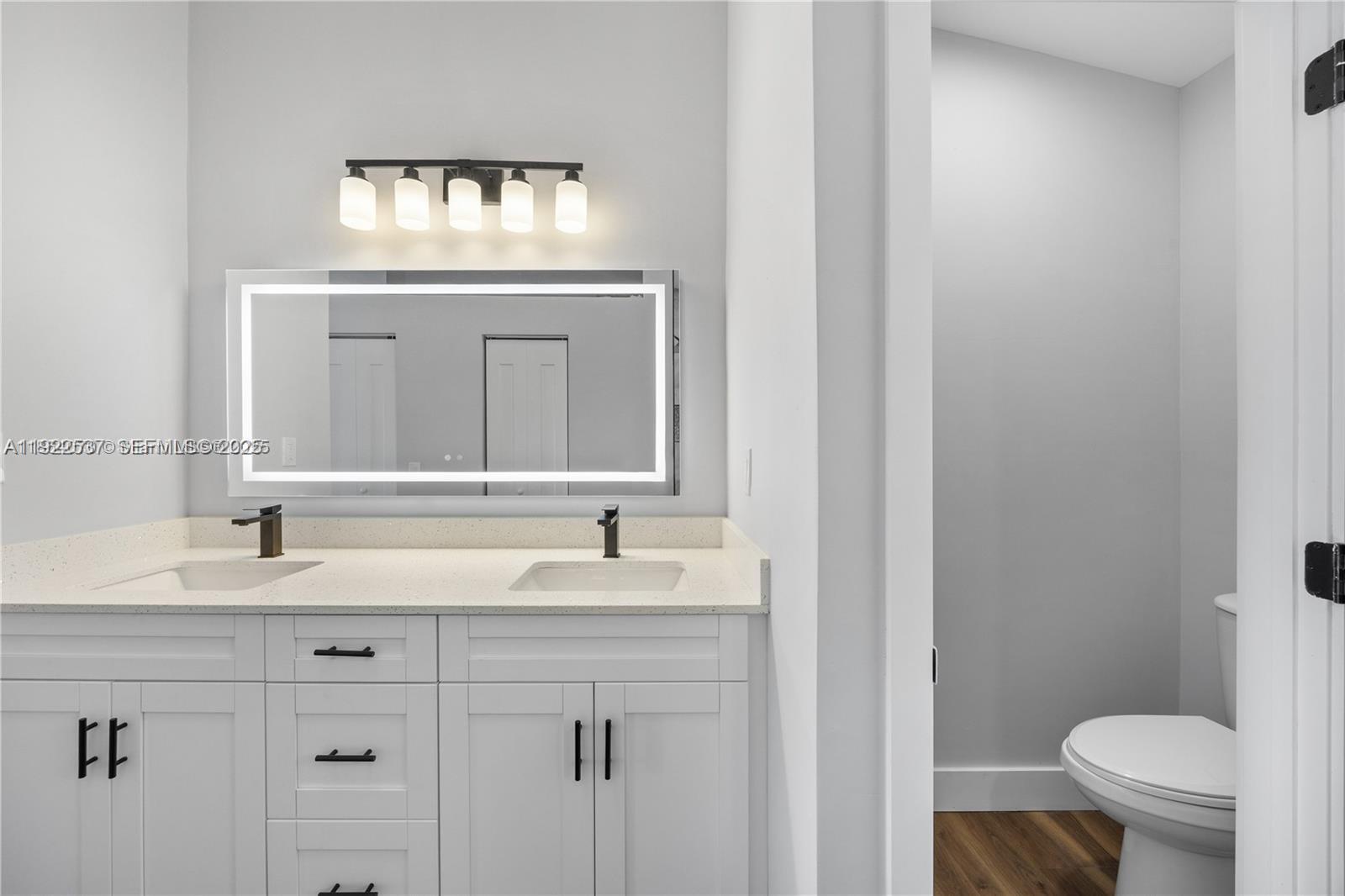 3835 Lombardy Street Hollywood, FL 33021 - Photo 17 of 25 a bathroom with a sink and a toilet