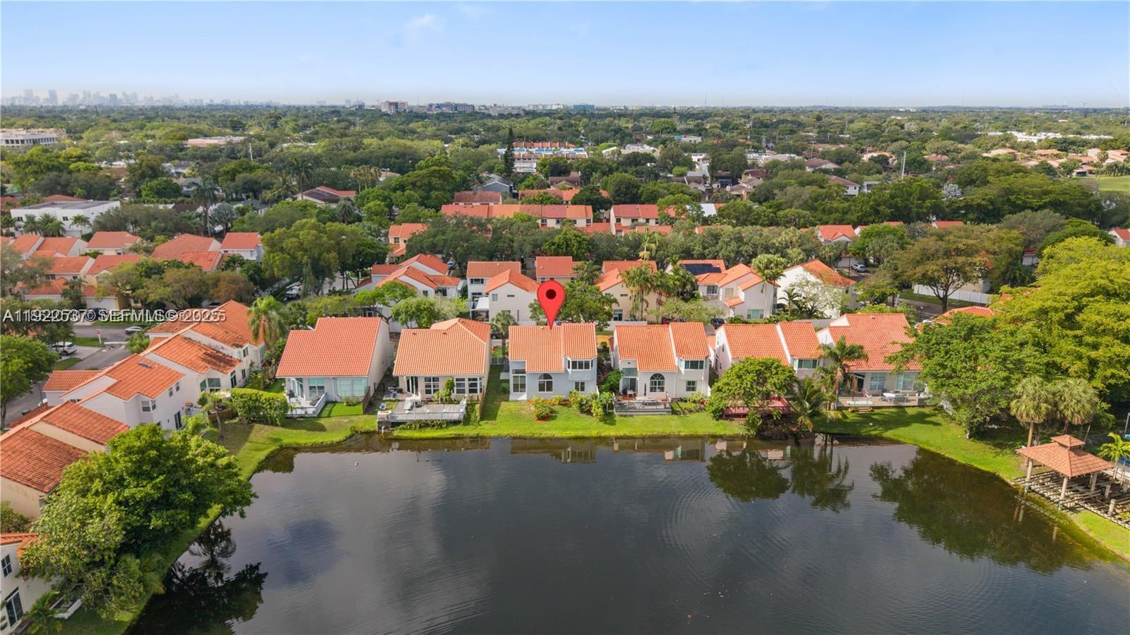 3835 Lombardy Street Hollywood, FL 33021 - Photo 4 of 25 an aerial view of residential houses with outdoor space and lake view