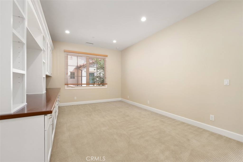 61 Triana Irvine, CA 92618 - Photo 25 of 56 an empty room with windows and mountain view