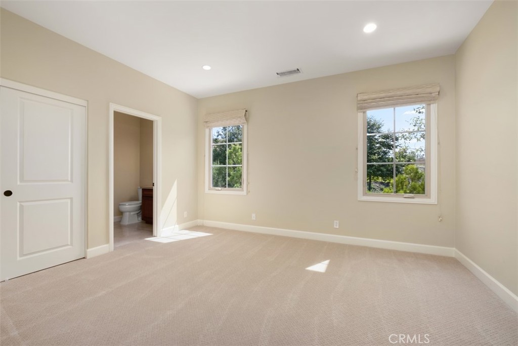 61 Triana Irvine, CA 92618 - Photo 29 of 56 an empty room with windows and closet