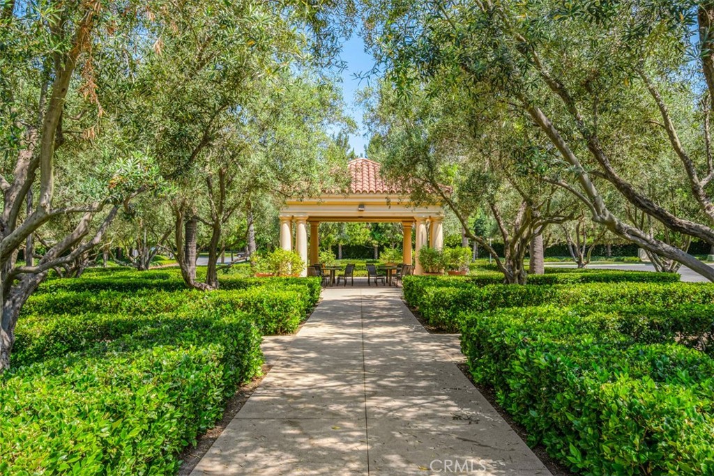 61 Triana Irvine, CA 92618 - Photo 39 of 56 a front view of a house with a garden and plants