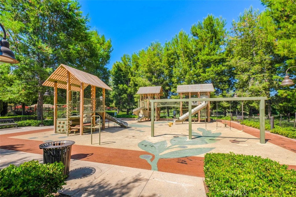61 Triana Irvine, CA 92618 - Photo 42 of 56 a view of a patio with a table and chairs