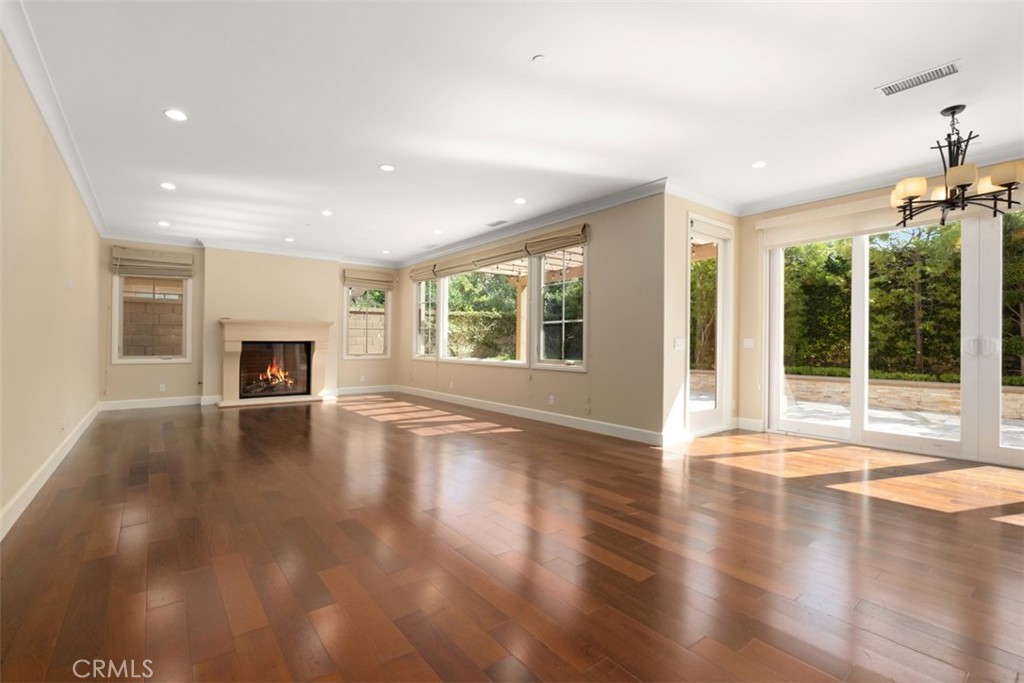 61 Triana Irvine, CA 92618 - Photo 5 of 56 a view of empty room with wooden floor and fireplace
