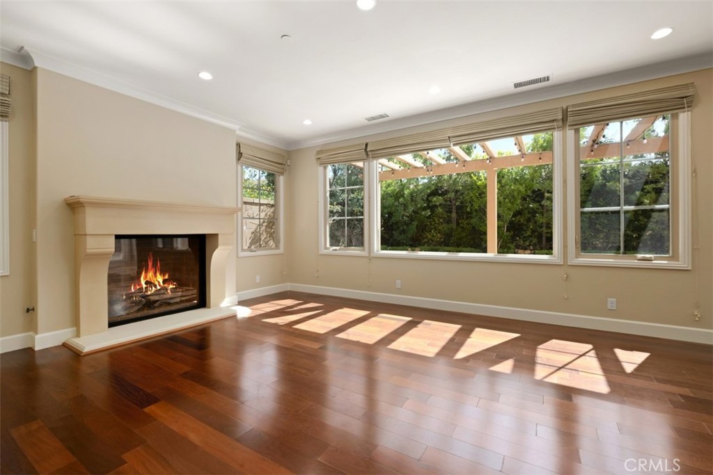 61 Triana Irvine, CA 92618 - Photo 8 of 56 a view of an empty room with wooden floor and a window