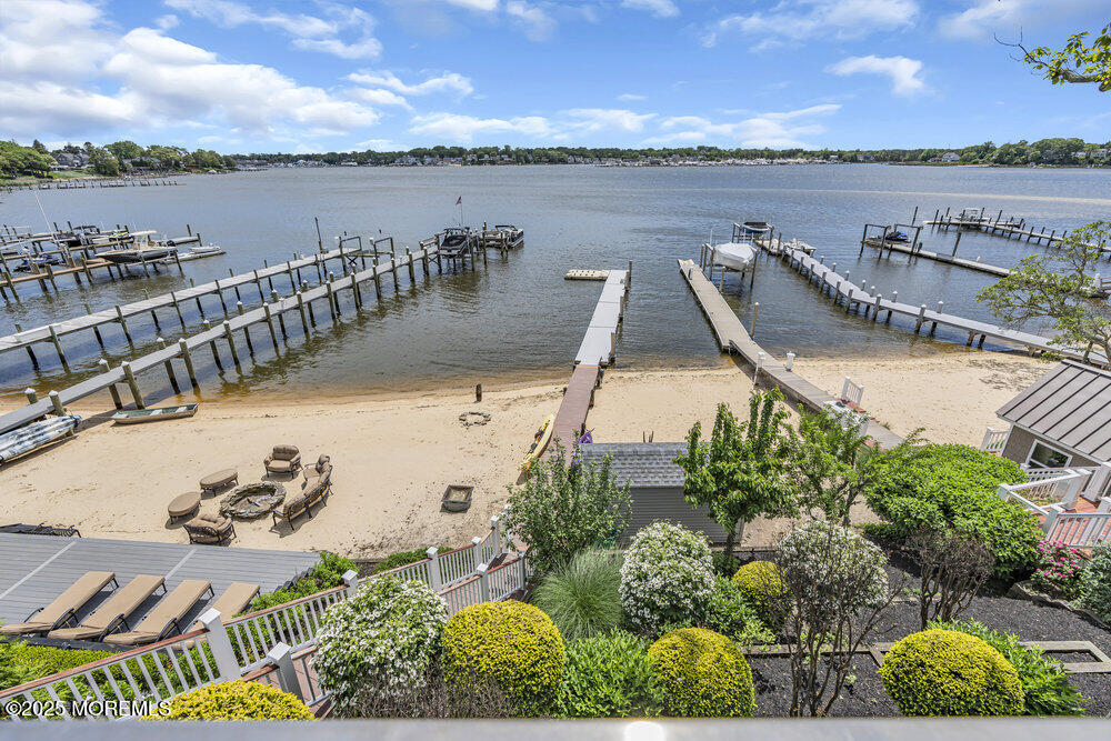 2547 River Road Manasquan, NJ 08736 - Photo 30 of 75 a view of a lake with a table and chairs