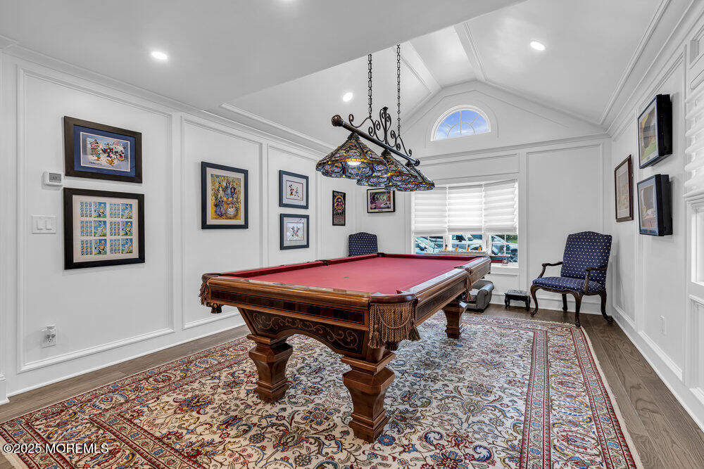 2547 River Road Manasquan, NJ 08736 - Photo 37 of 75 a spacious bedroom with a bed a desk and chair