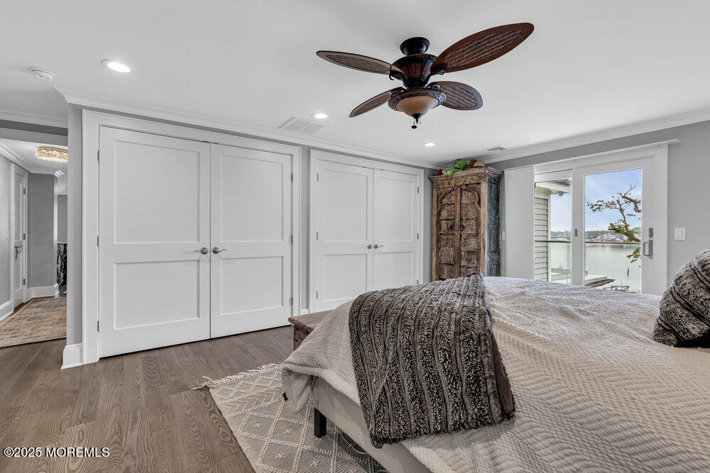 2547 River Road Manasquan, NJ 08736 - Photo 41 of 75 a living room with a bed furniture and a large window