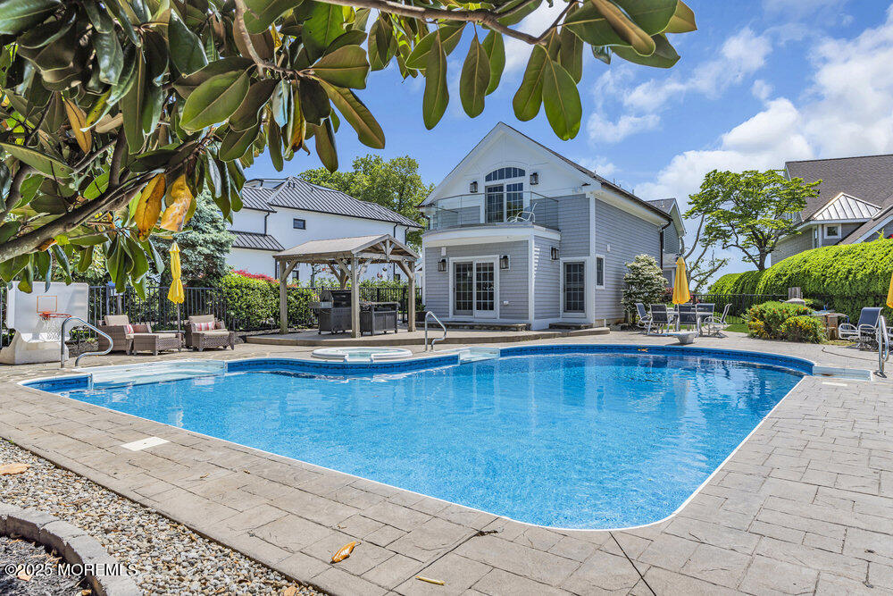 2547 River Road Manasquan, NJ 08736 - Photo 5 of 75 a view of house with swimming pool outdoor seating