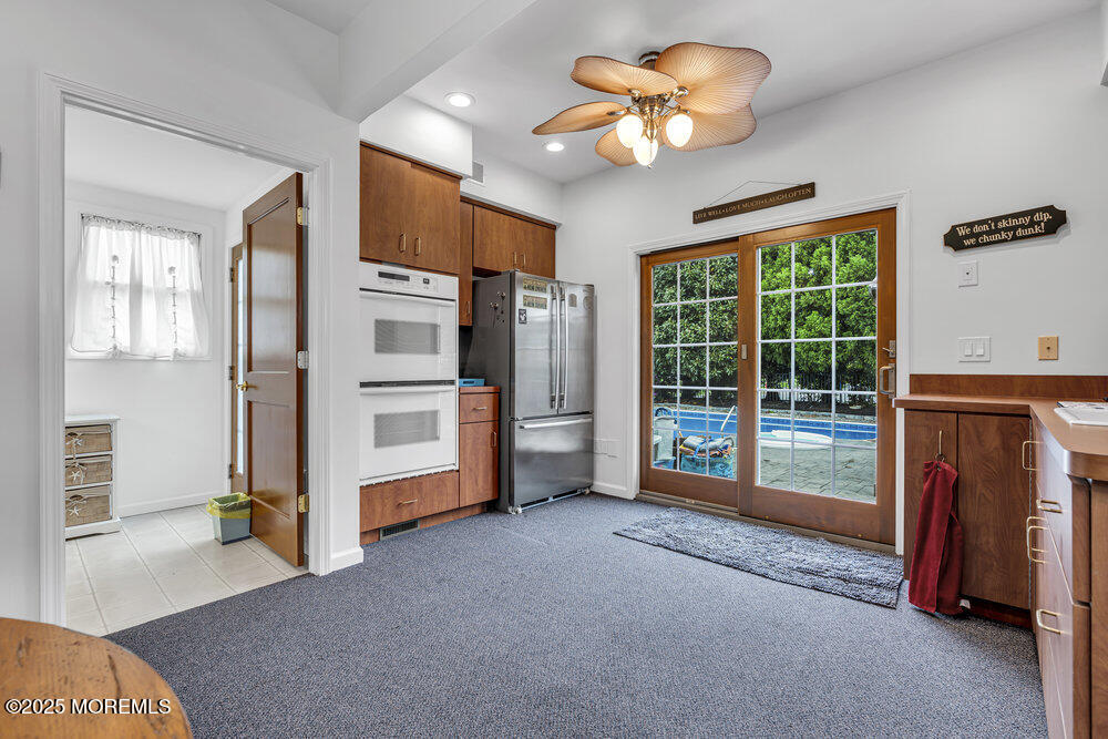 2547 River Road Manasquan, NJ 08736 - Photo 54 of 75 a view of a livingroom with furniture and a ceiling fan