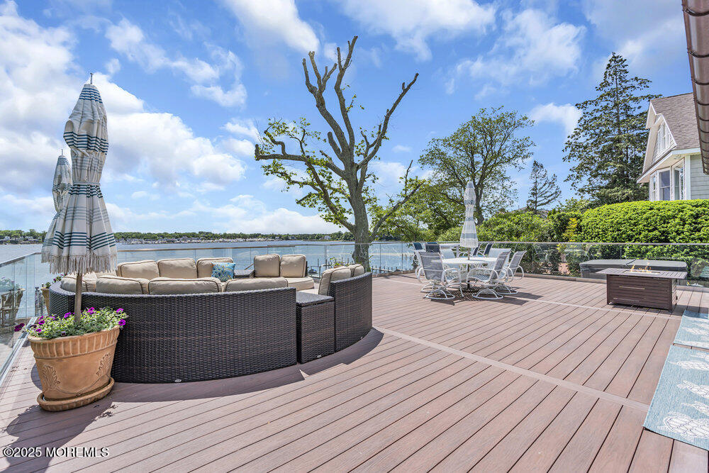 2547 River Road Manasquan, NJ 08736 - Photo 64 of 75 a view of roof deck with couches and potted plants