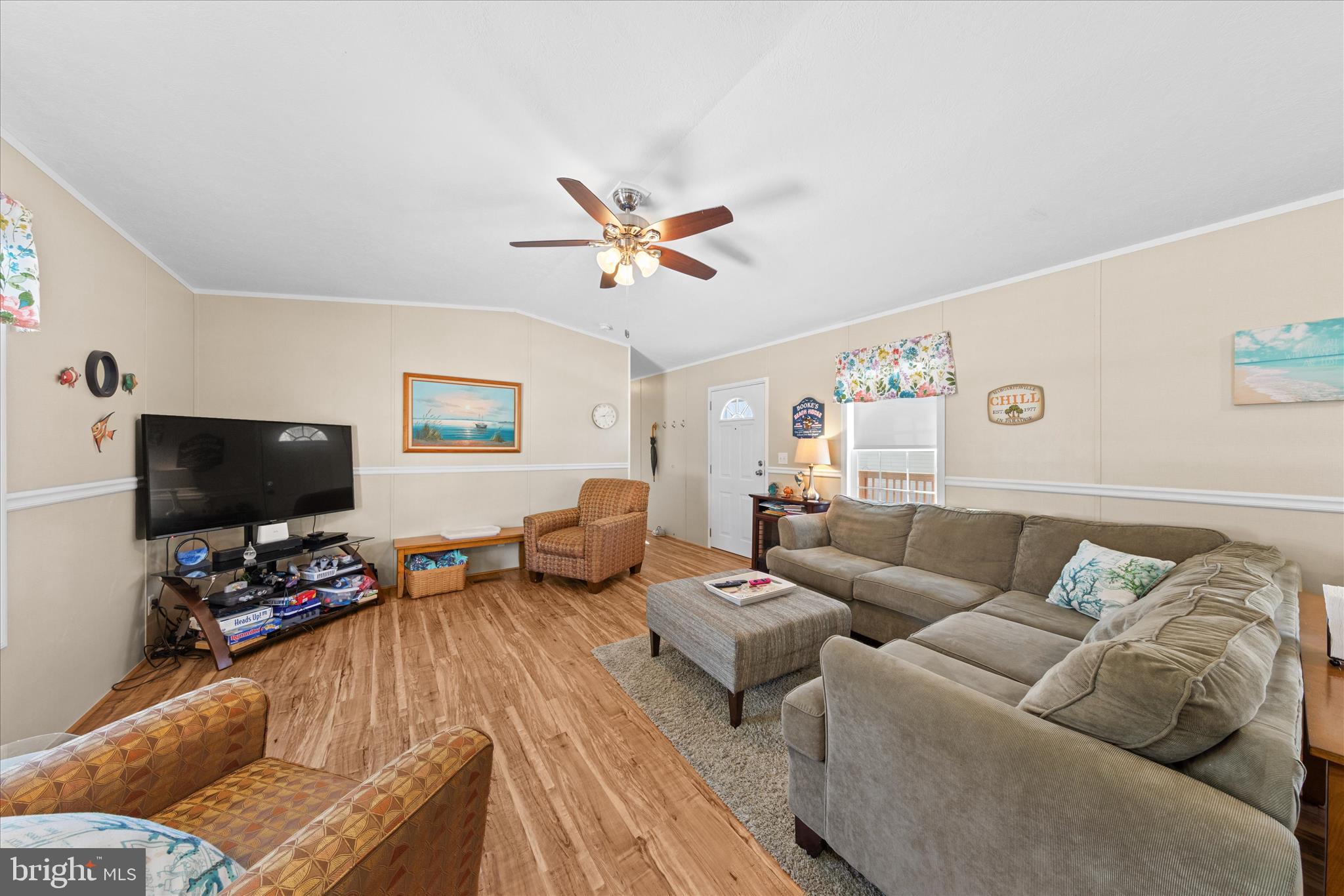 33461 Daisy Street Lewes, DE 19958 - Photo 11 of 42 a living room with furniture and a flat screen tv