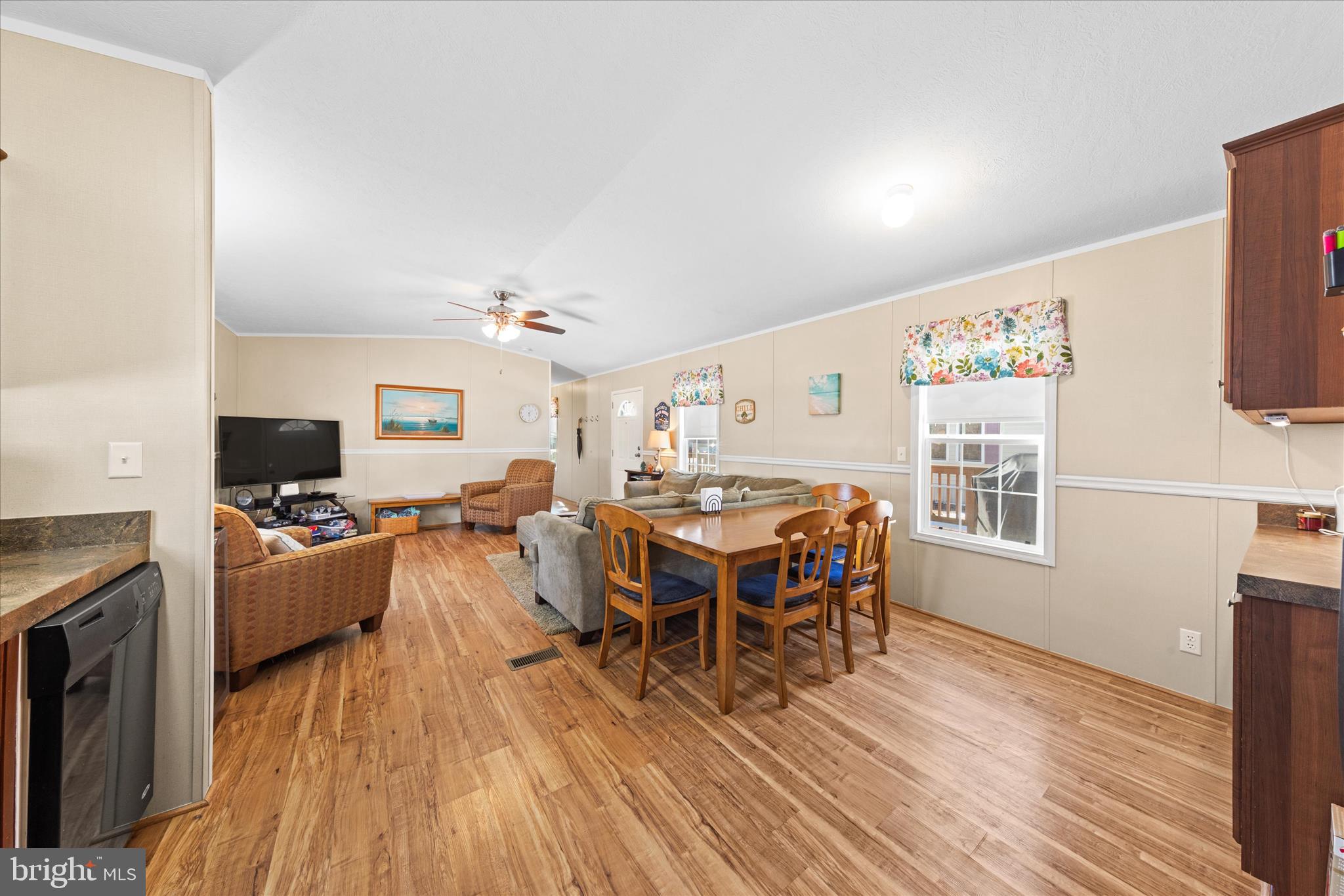 33461 Daisy Street Lewes, DE 19958 - Photo 15 of 42 a view of a dining room with furniture window and wooden floor