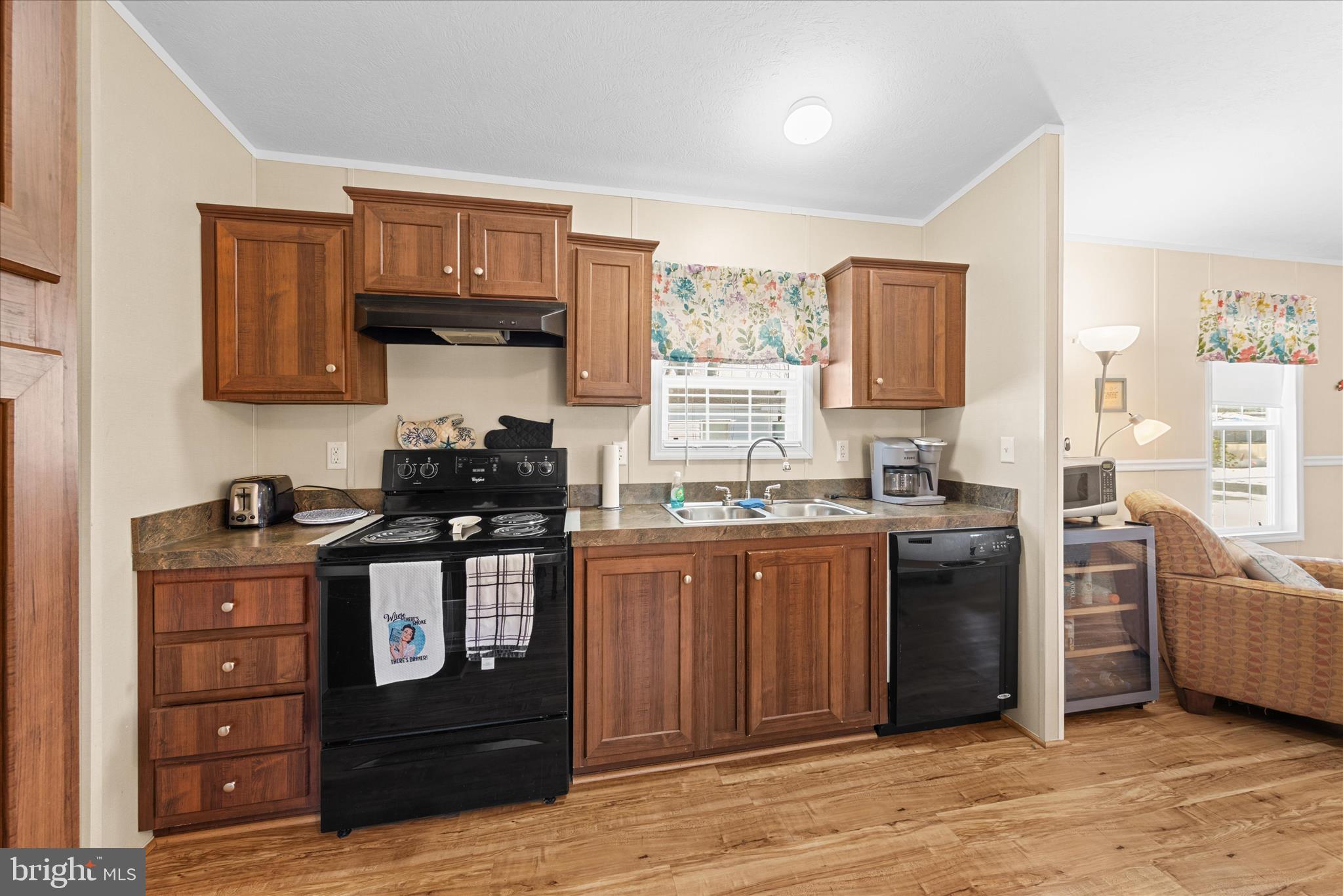33461 Daisy Street Lewes, DE 19958 - Photo 20 of 42 a kitchen with stainless steel appliances granite countertop a stove and a sink