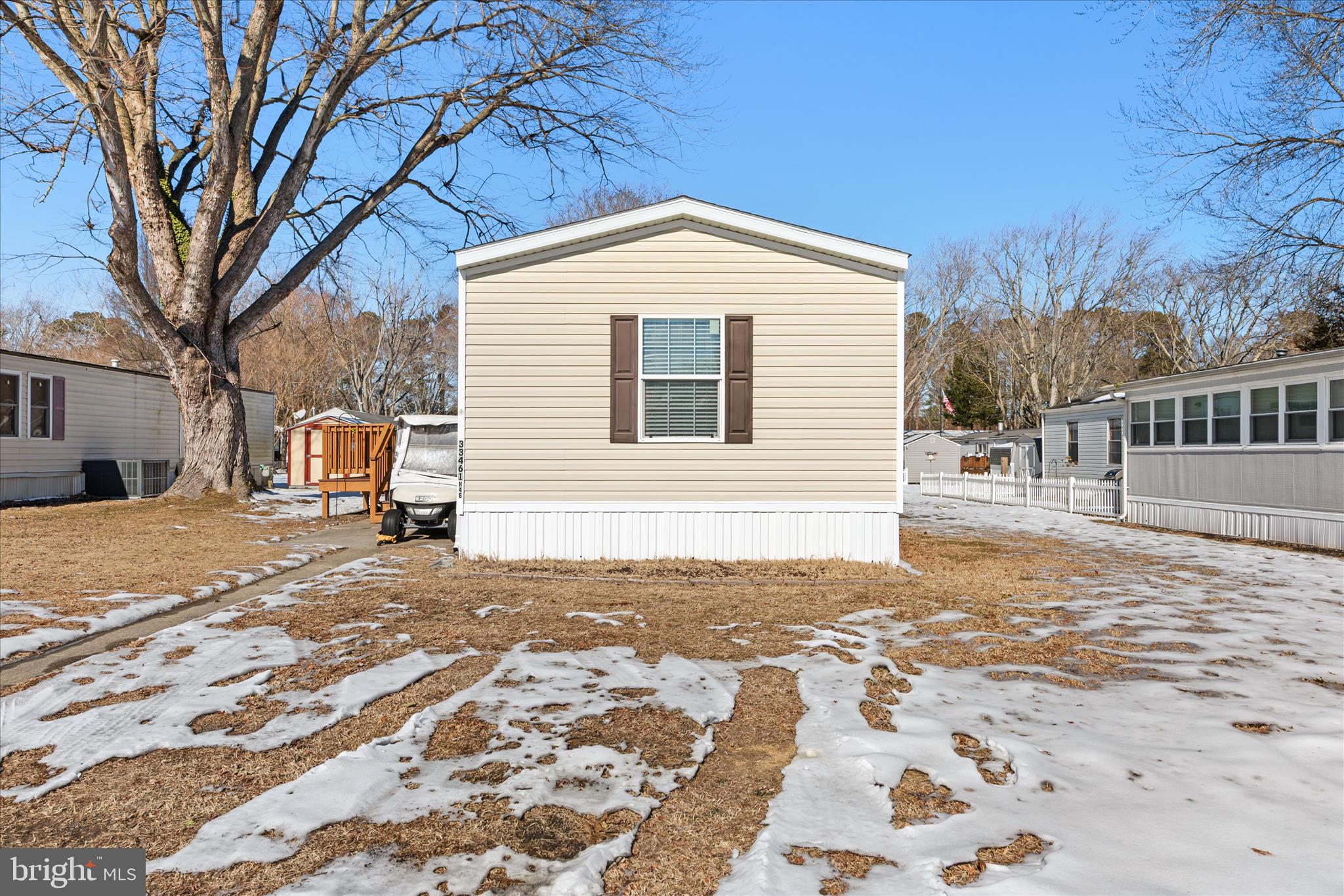 33461 Daisy Street Lewes, DE 19958 - Photo 2 of 42 a view of a house with snow on the road