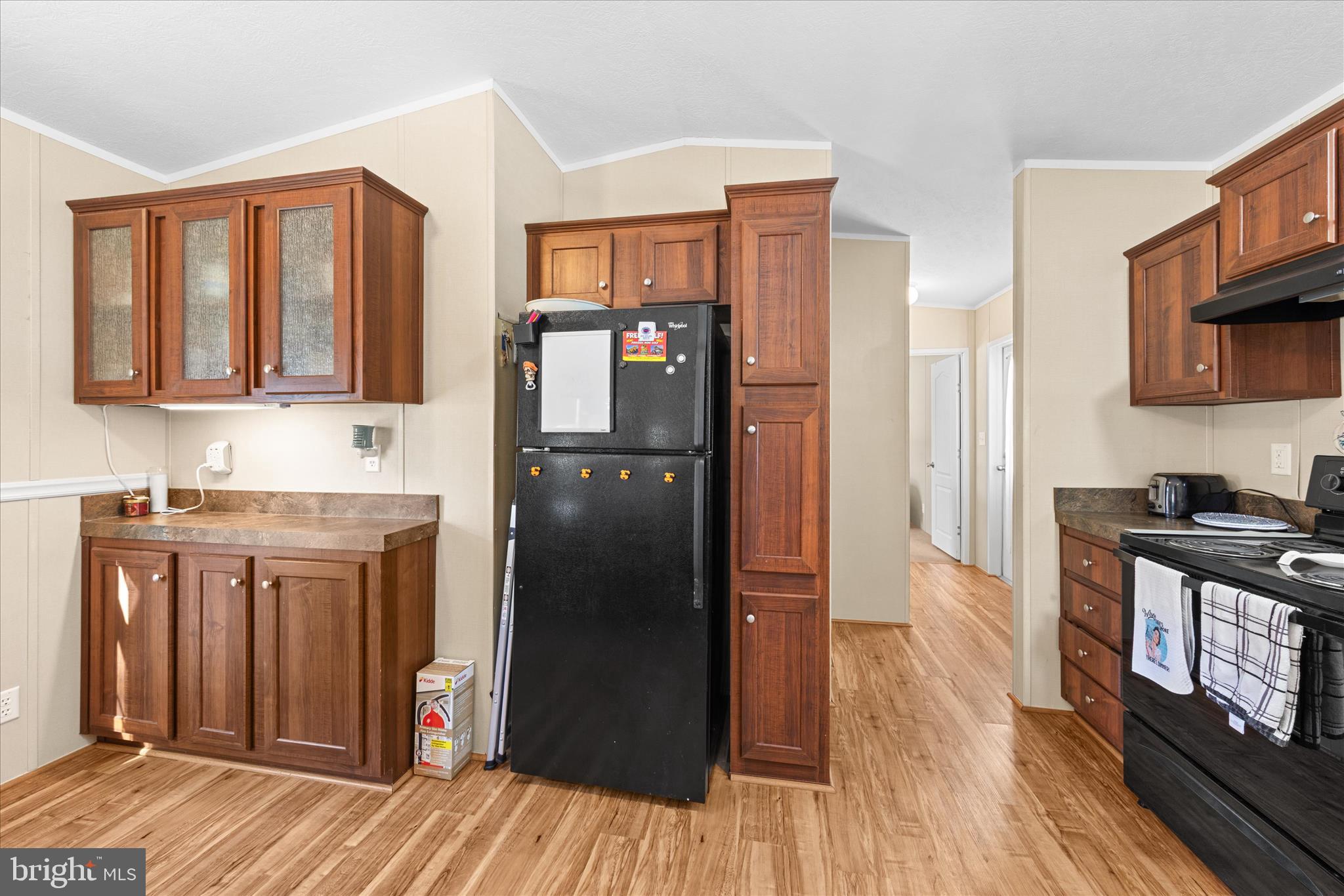 33461 Daisy Street Lewes, DE 19958 - Photo 21 of 42 a kitchen with stainless steel appliances granite countertop a refrigerator stove and sink