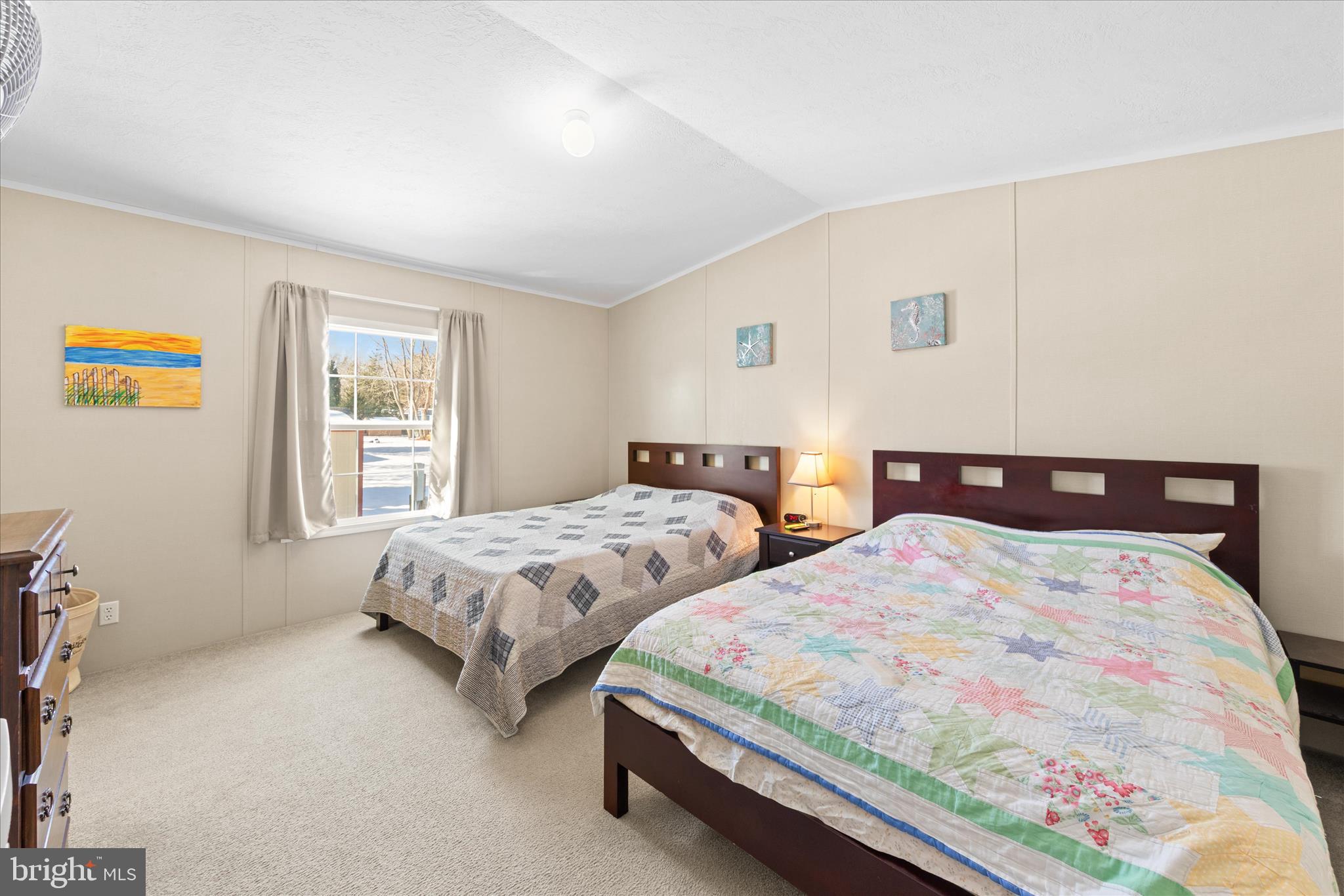 33461 Daisy Street Lewes, DE 19958 - Photo 22 of 42 a bedroom with two beds and painting on the wall