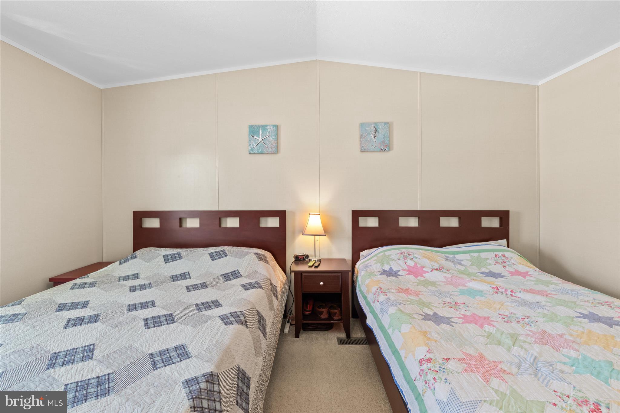 33461 Daisy Street Lewes, DE 19958 - Photo 24 of 42 a bedroom with two beds and a lamp
