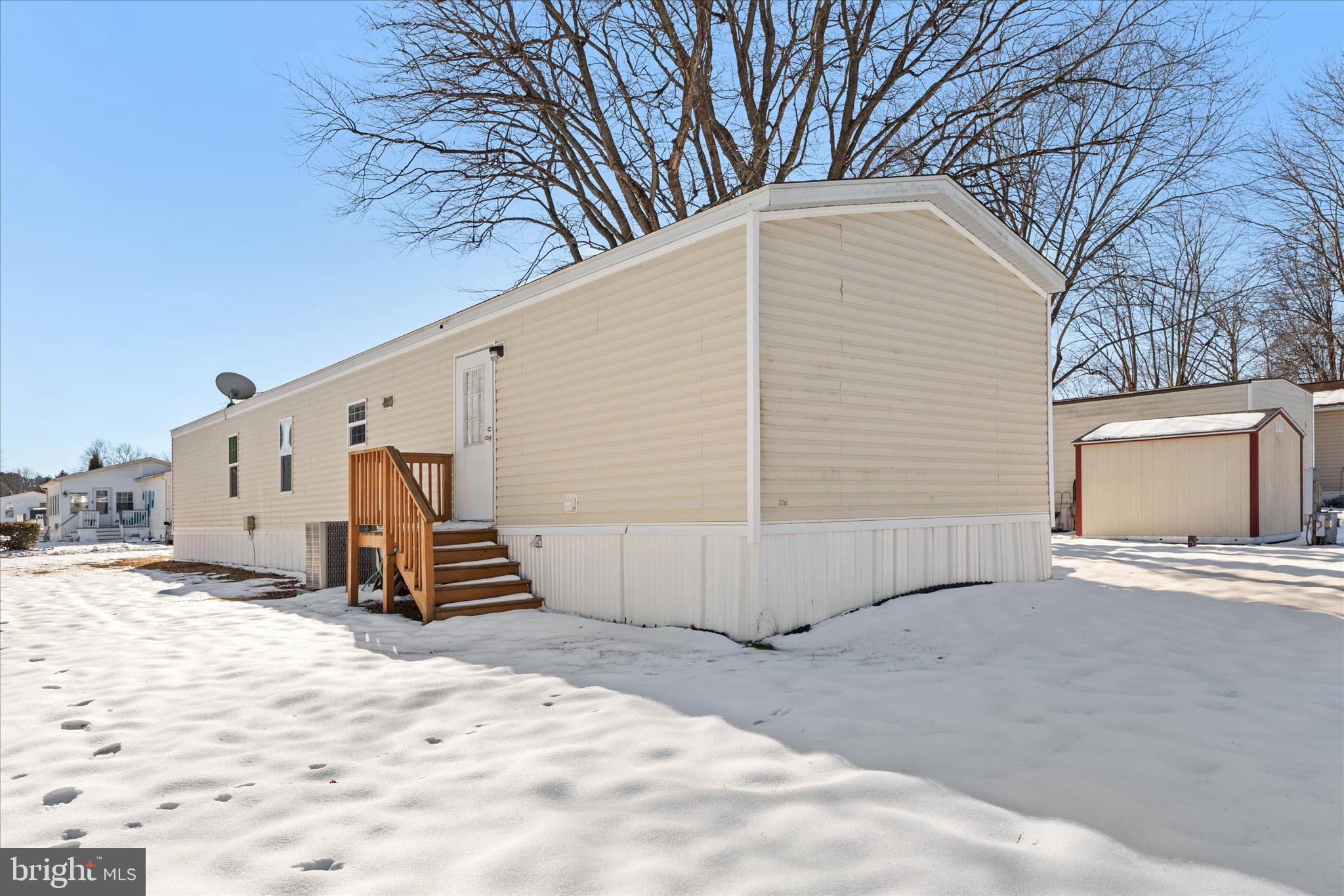 33461 Daisy Street Lewes, DE 19958 - Photo 42 of 42 a view of a house with a snow in the yard