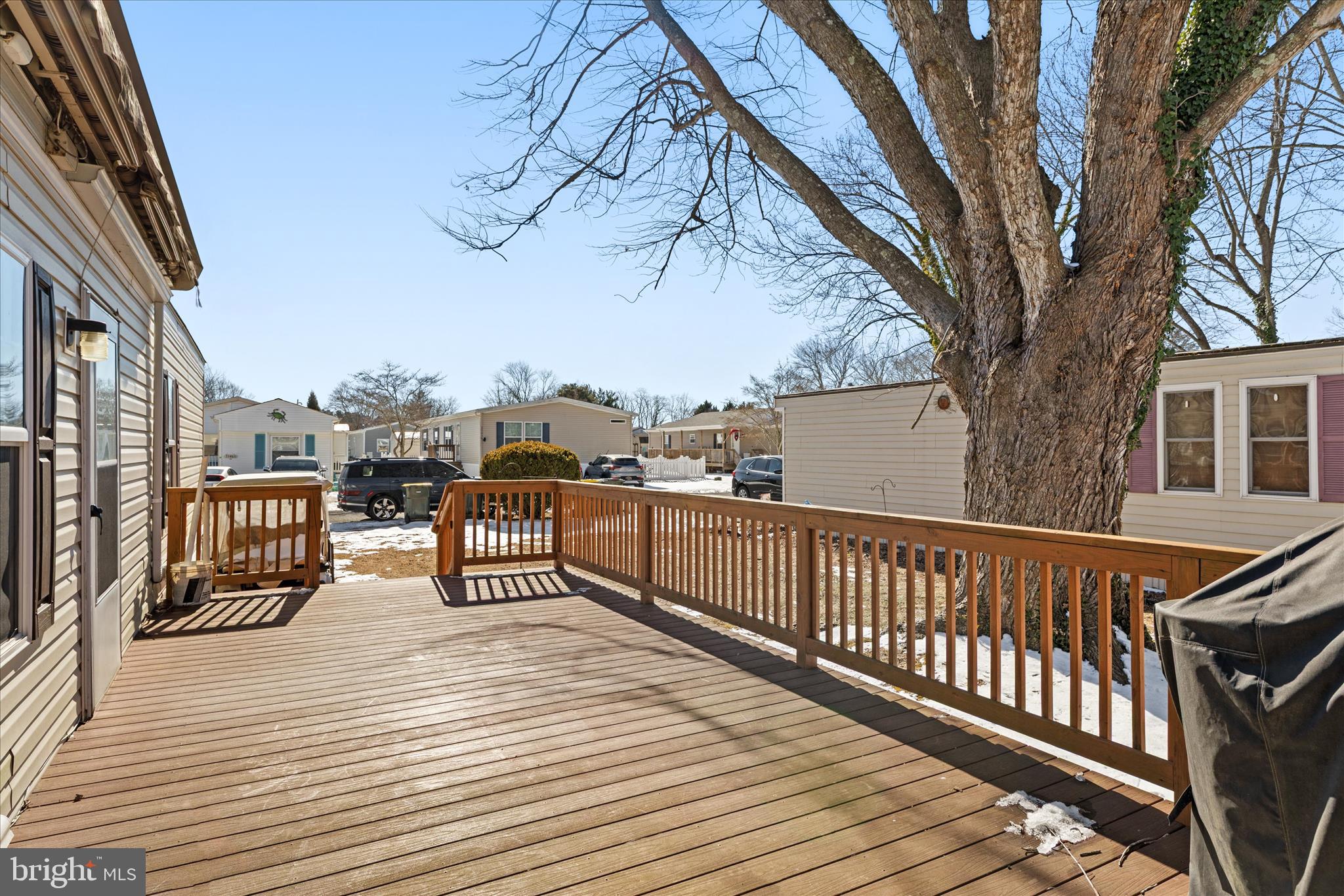 33461 Daisy Street Lewes, DE 19958 - Photo 8 of 42 a view of a terrace with wooden floor and fence