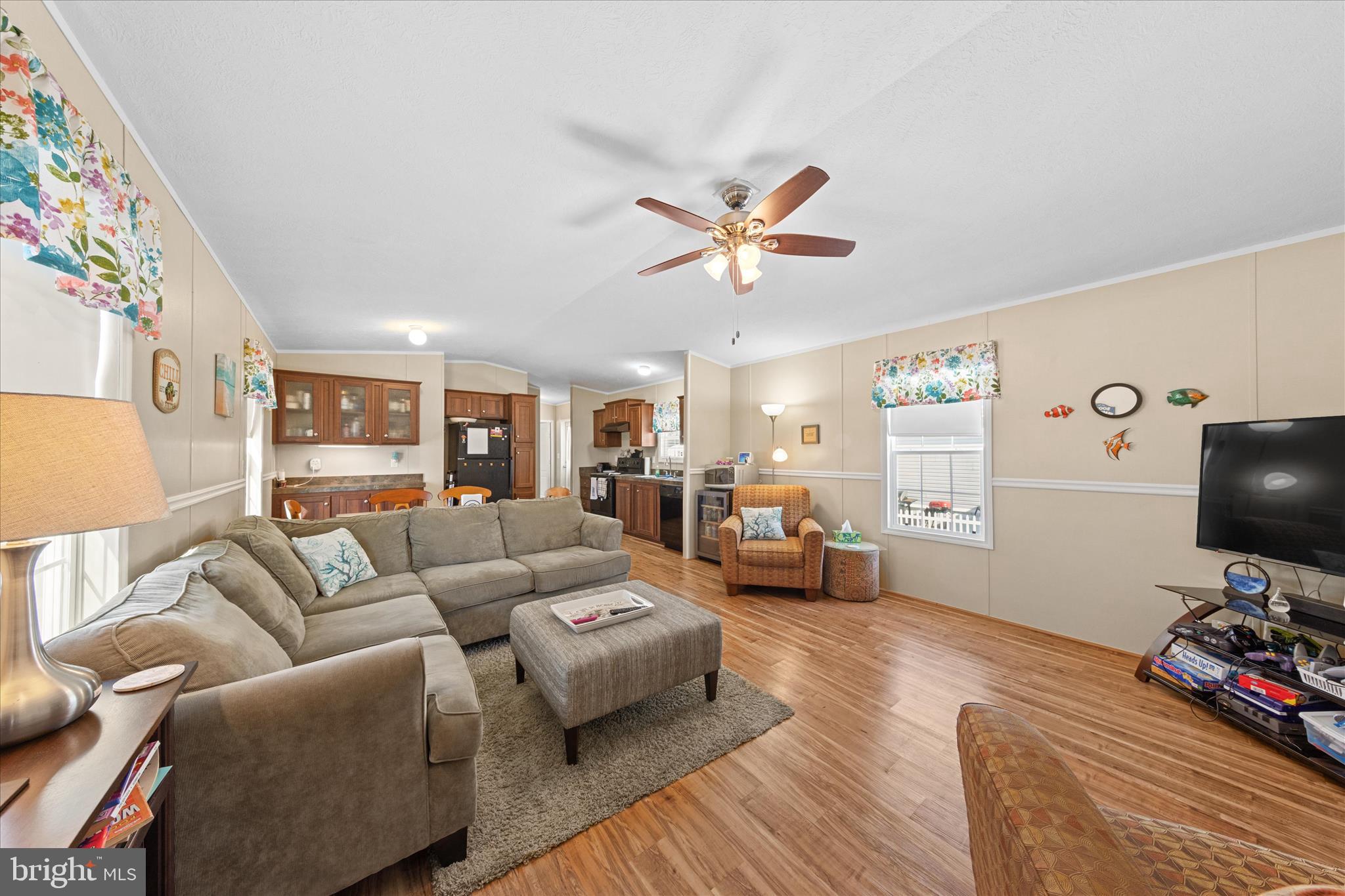 33461 Daisy Street Lewes, DE 19958 - Photo 9 of 42 a living room with furniture and a flat screen tv