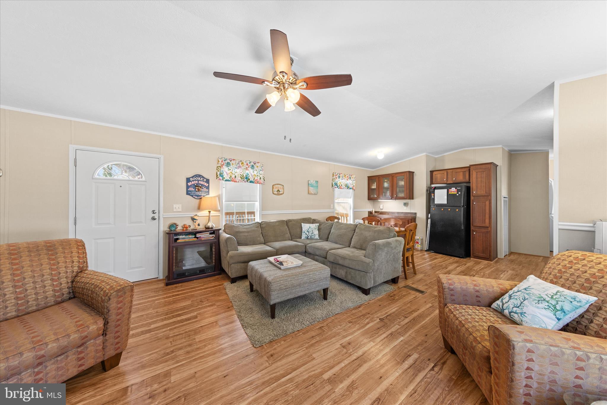 33461 Daisy Street Lewes, DE 19958 - Photo 10 of 42 a living room with furniture and a ceiling fan