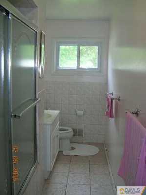 12 Bucknell Road Old Bridge, NJ 08859 - Photo 6 of 8 a bathroom with a toilet and a shower
