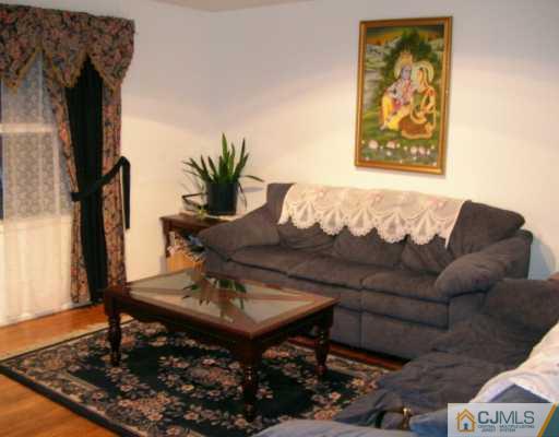 12 Bucknell Road Old Bridge, NJ 08859 - Photo 7 of 8 a living room with furniture and a window