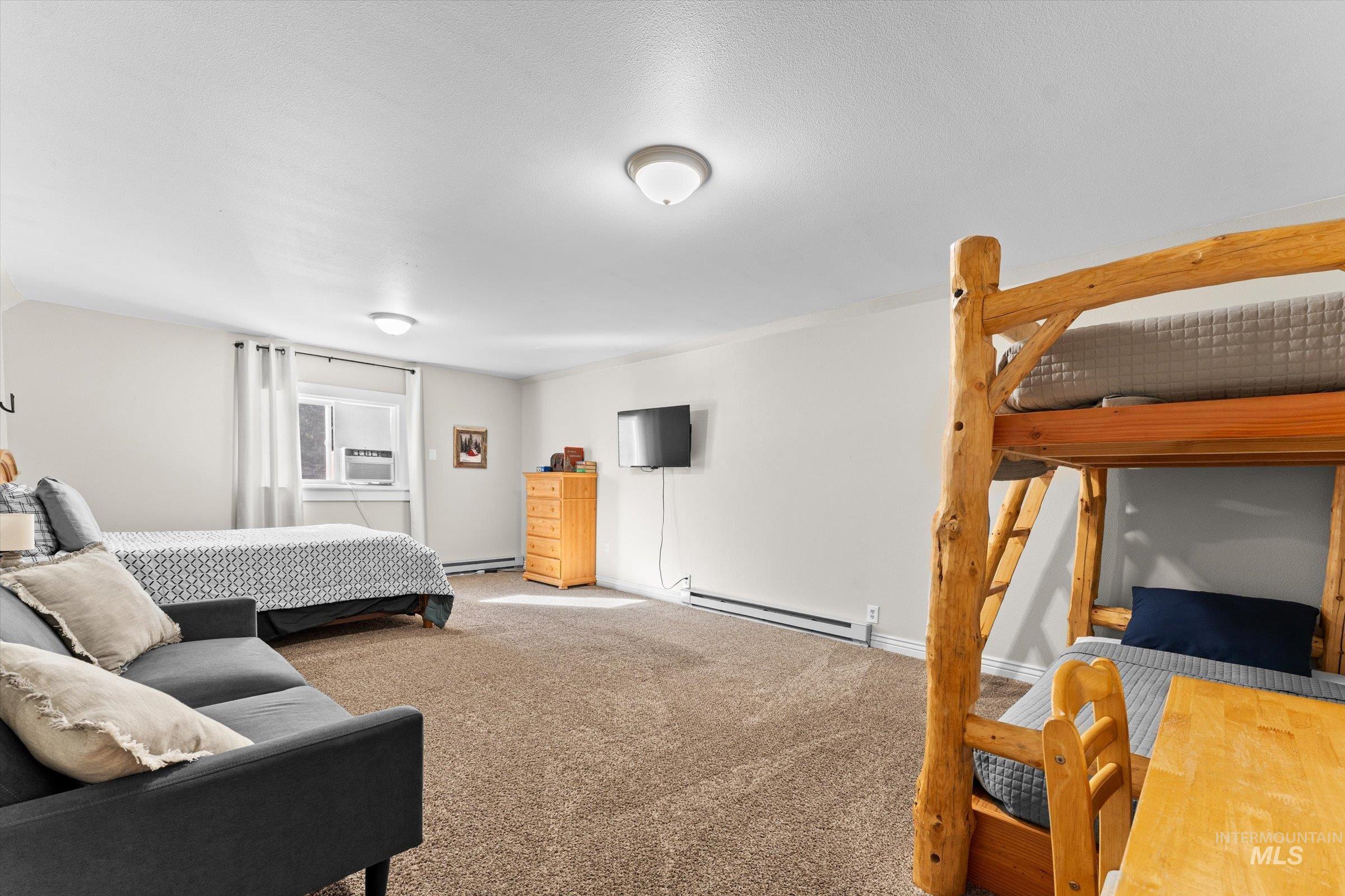 315 South Middlefork Road Garden Valley, ID 83622 - Photo 25 of 49 Bedroom featuring carpet and baseboard heating