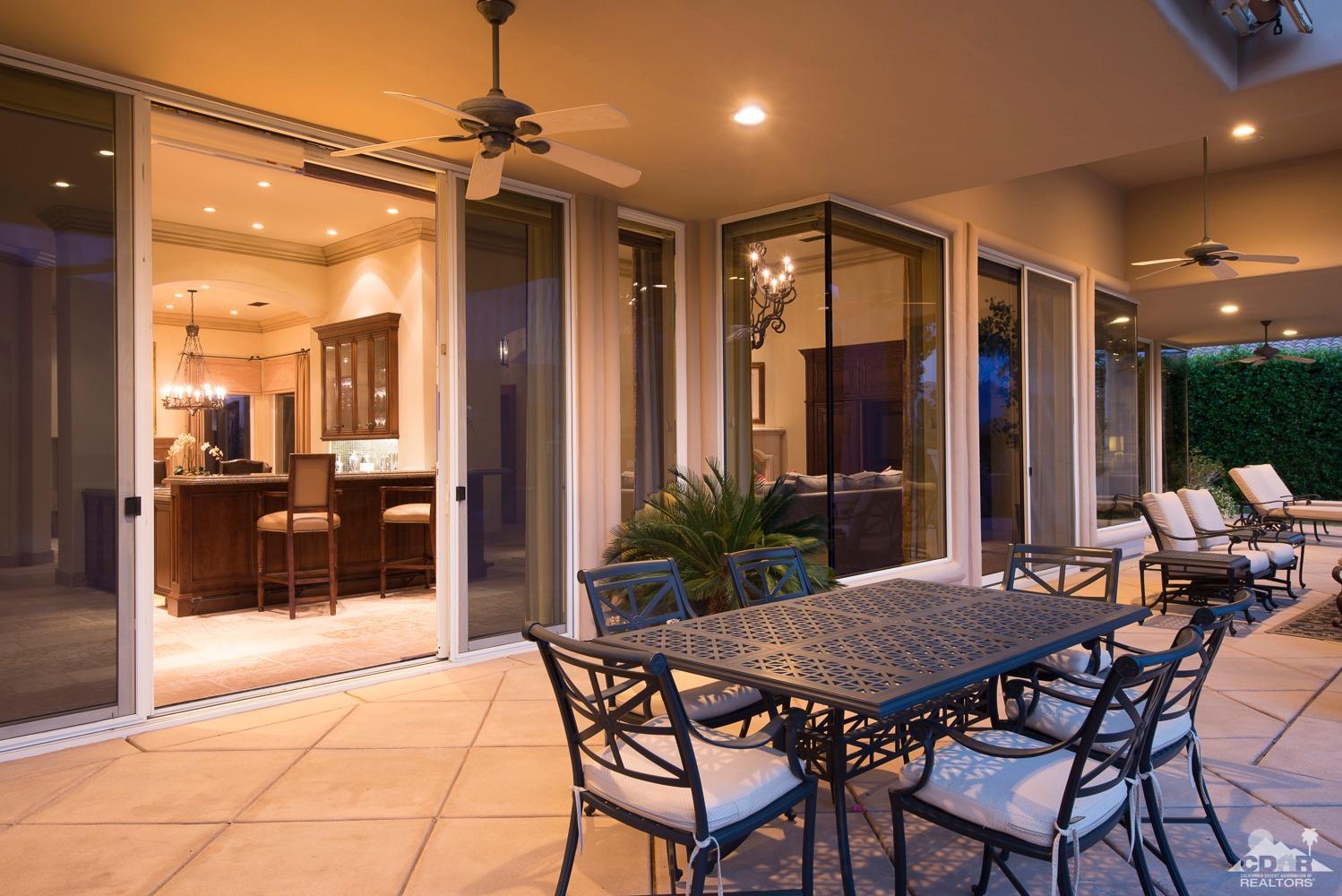 80515 Weiskopf La Quinta, CA 92253 - Photo 12 of 46 a view of a patio with dining table and chairs