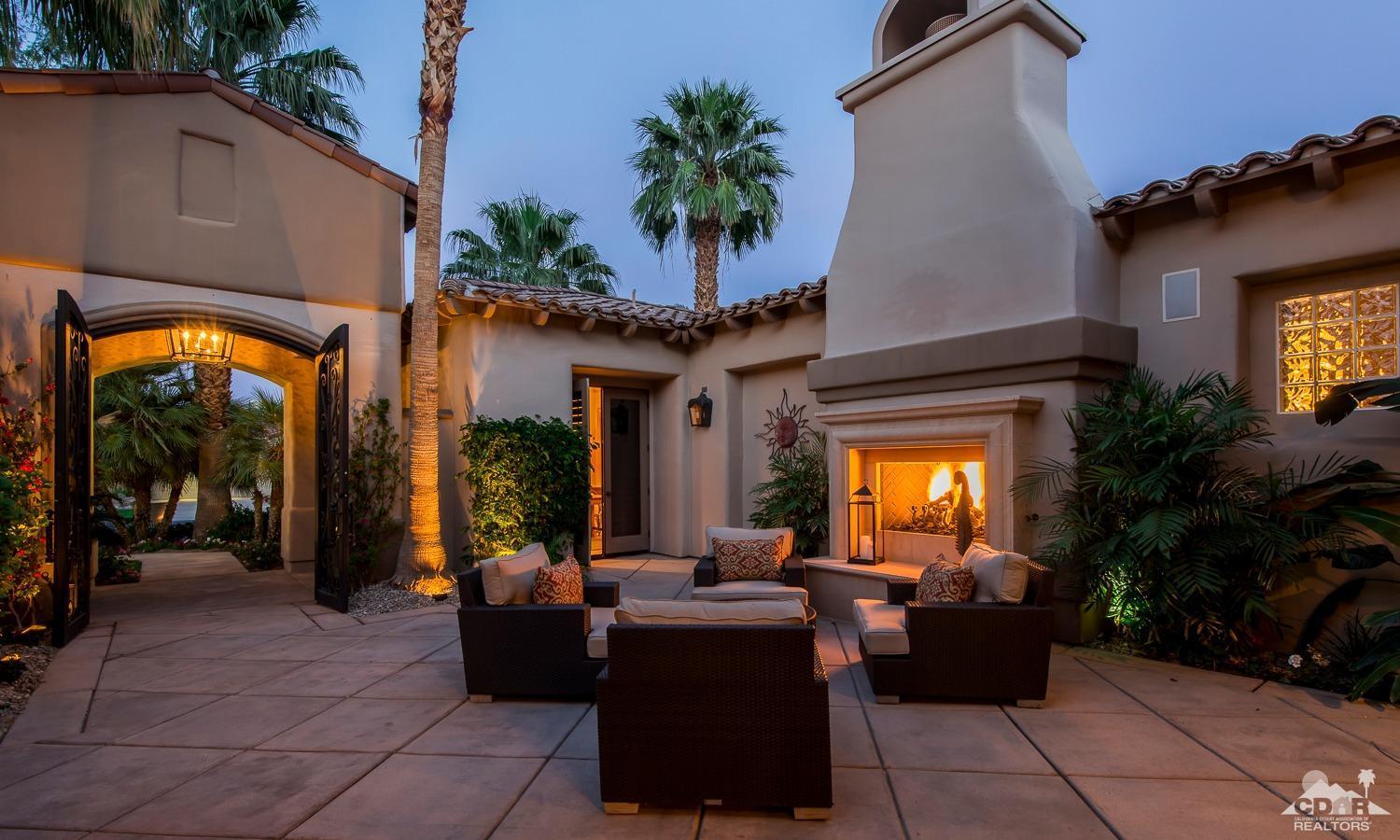 80515 Weiskopf La Quinta, CA 92253 - Photo 16 of 46 a living room with furniture and a potted plant