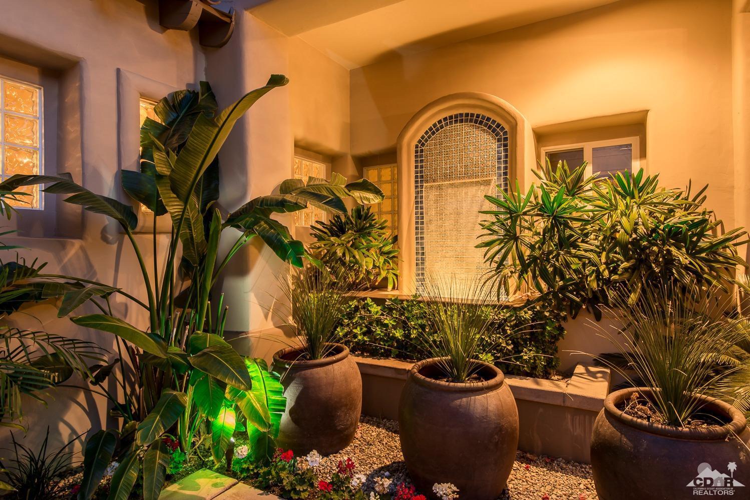 80515 Weiskopf La Quinta, CA 92253 - Photo 18 of 46 a front view of a house with garden