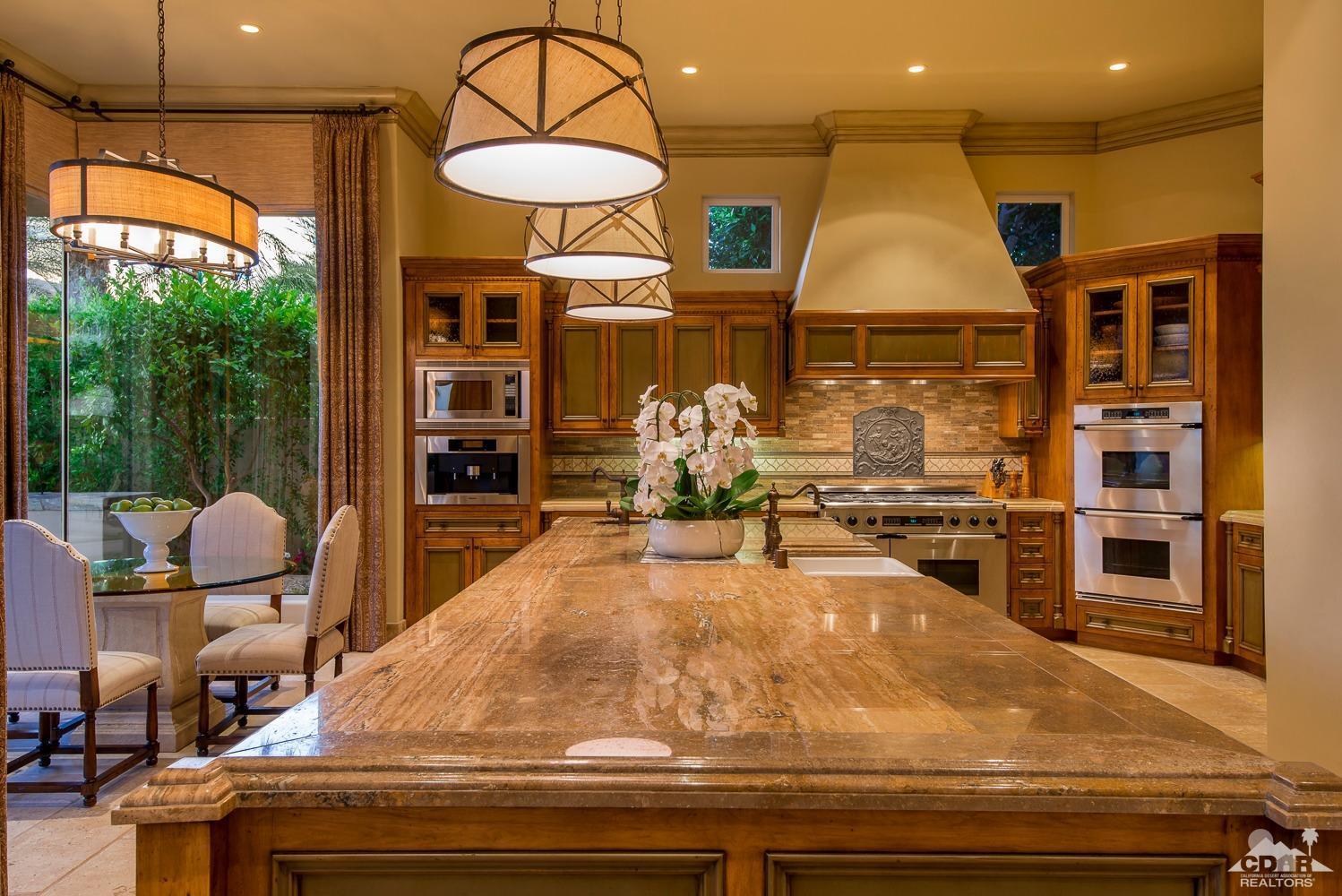 80515 Weiskopf La Quinta, CA 92253 - Photo 31 of 46 a room with lots of wooden furniture and a chandelier