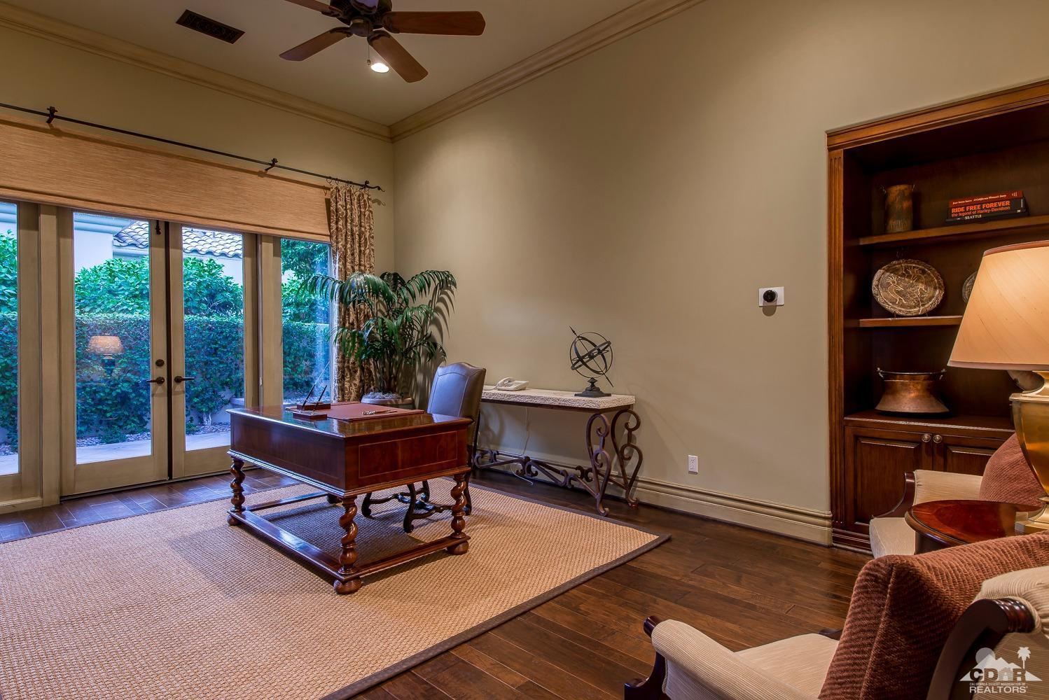 80515 Weiskopf La Quinta, CA 92253 - Photo 38 of 46 a living room with furniture and a floor to ceiling window