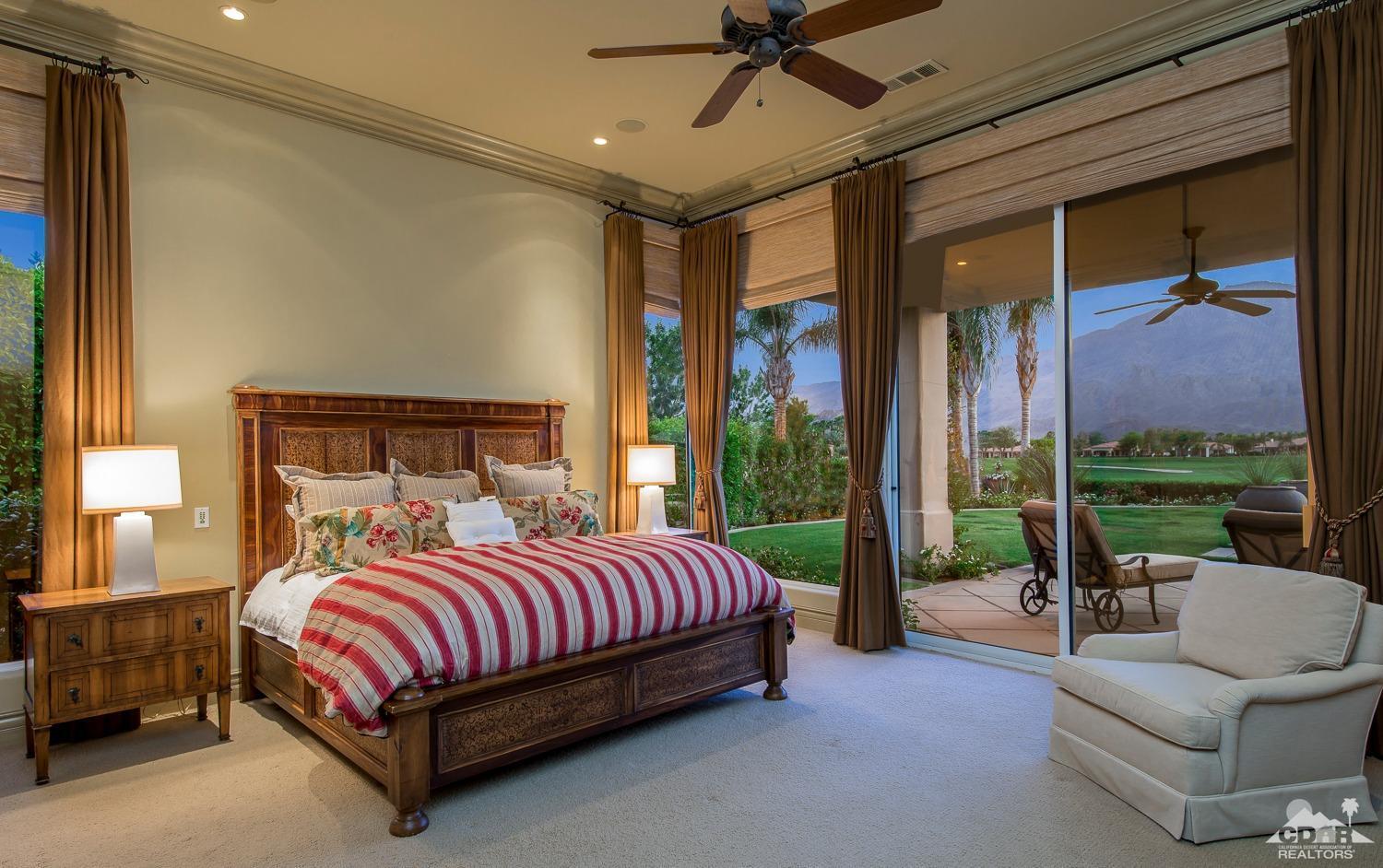 80515 Weiskopf La Quinta, CA 92253 - Photo 40 of 46 a bedroom with a bed couch and a large window