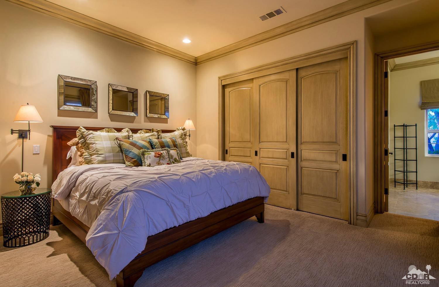 80515 Weiskopf La Quinta, CA 92253 - Photo 44 of 46 a bedroom with a bed and a cabinets