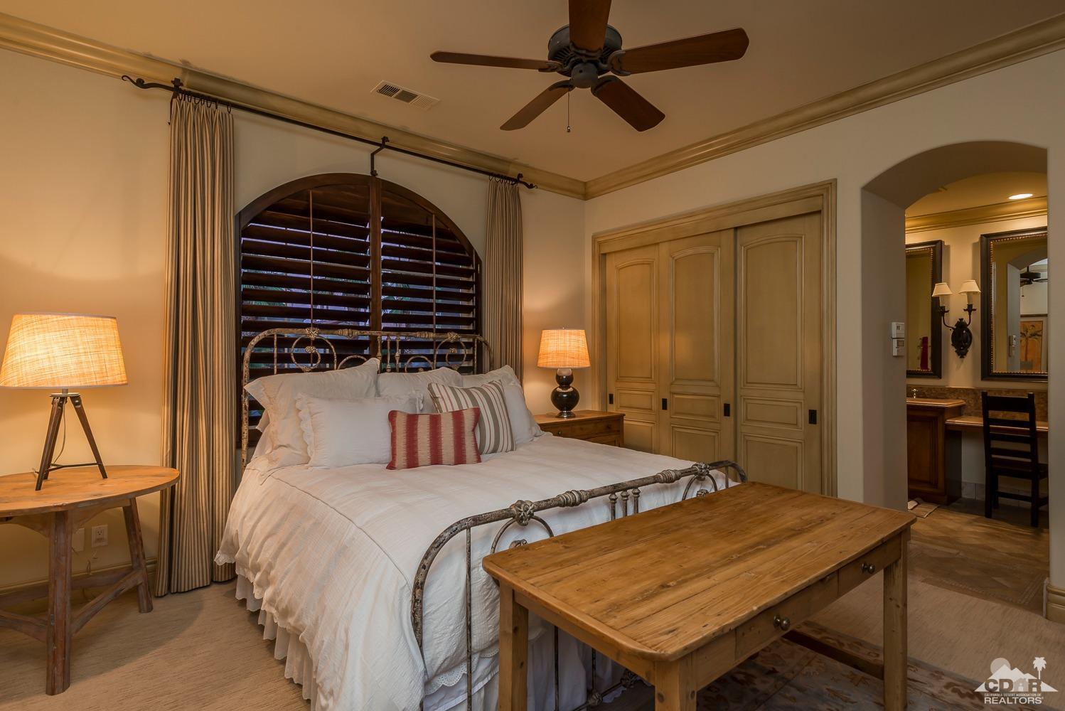 80515 Weiskopf La Quinta, CA 92253 - Photo 45 of 46 a bedroom with a bed and a table