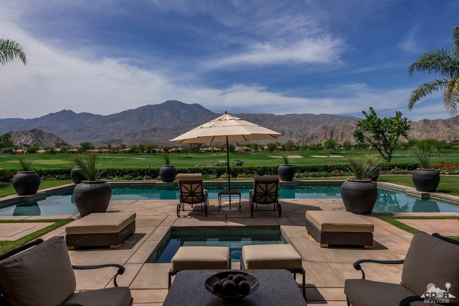 80515 Weiskopf La Quinta, CA 92253 - Photo 10 of 46 a view of a patio with couches potted plants and a big yard