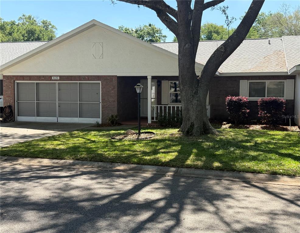 9529 Southwest 85th Avenue, Unit D Ocala, FL 34481 - Photo 1 of 21 a view of a house with a yard